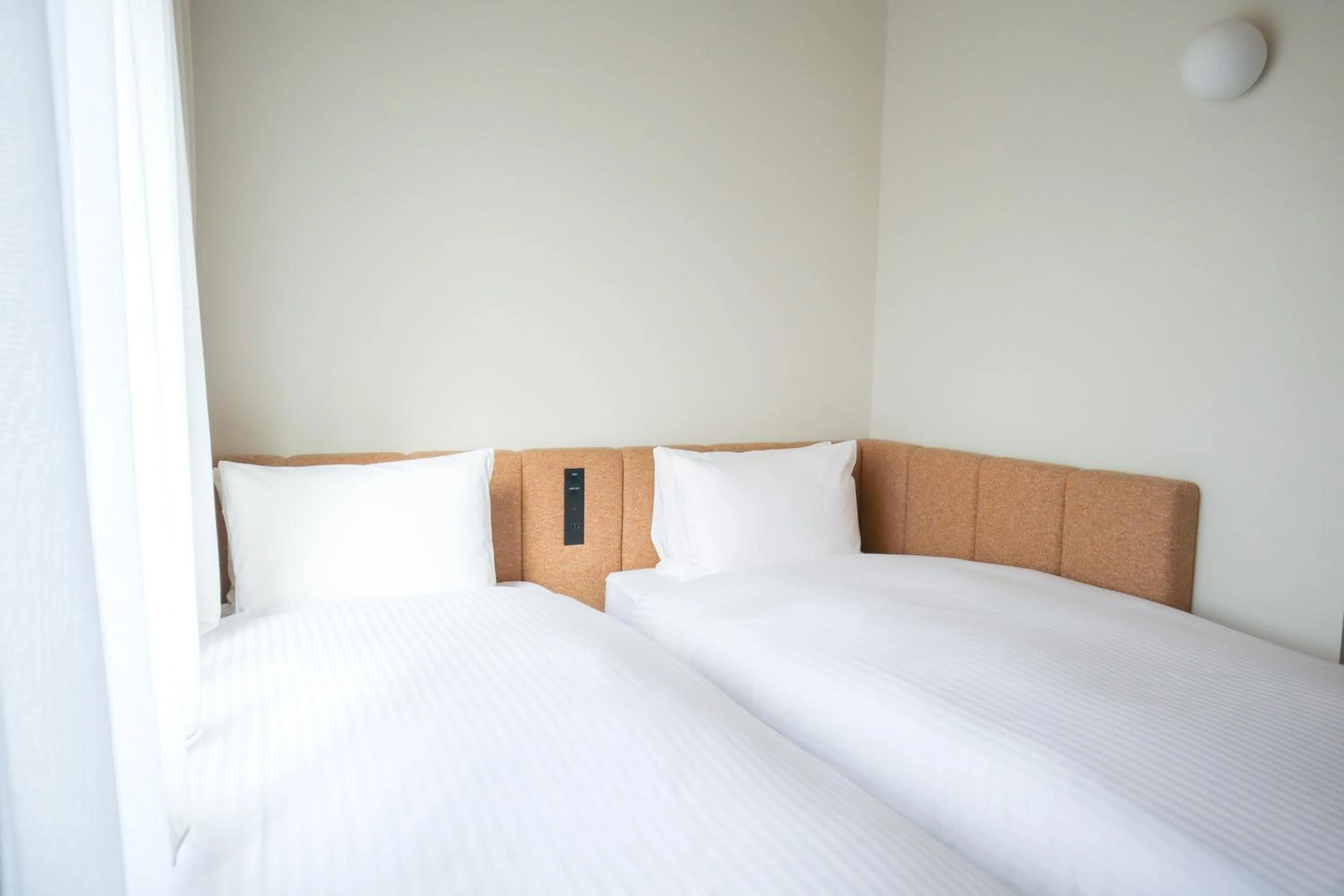 Bed in HOTEL AMANEK Asakusa Sakurabashi