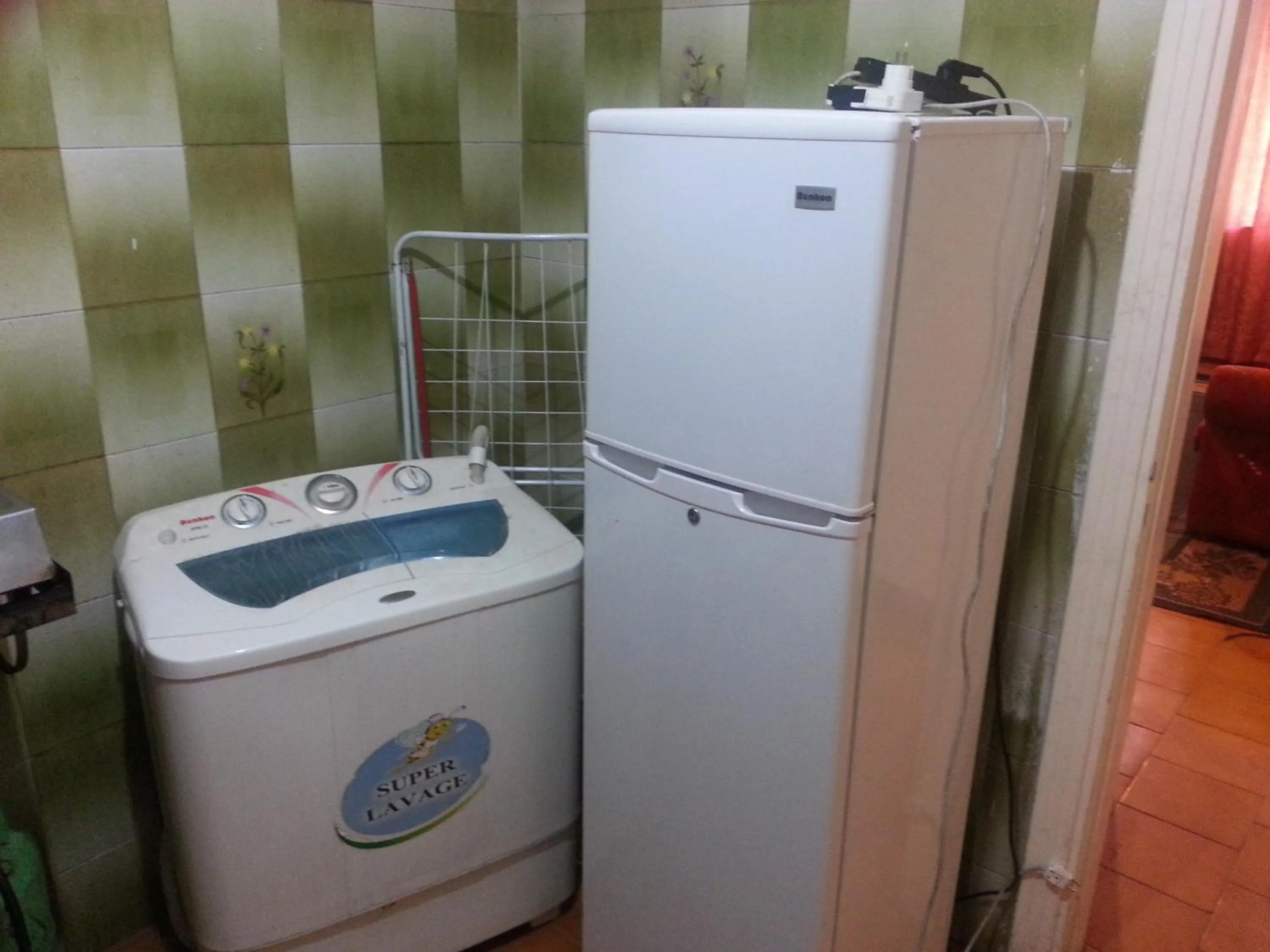 Kitchen or kitchenette in Aljazeera Hotel Apartments