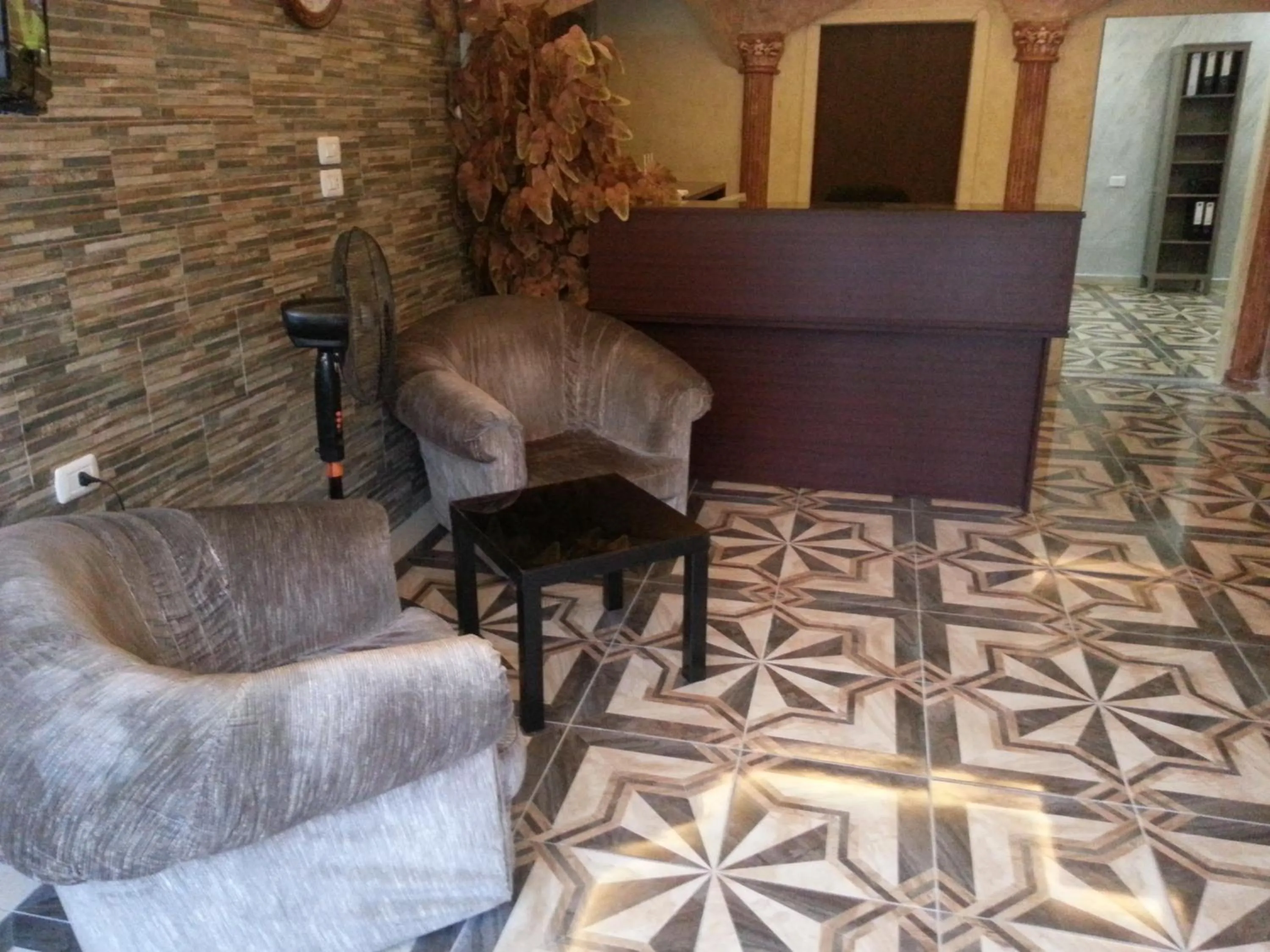 Communal lounge/ TV room in Aljazeera Hotel Apartments