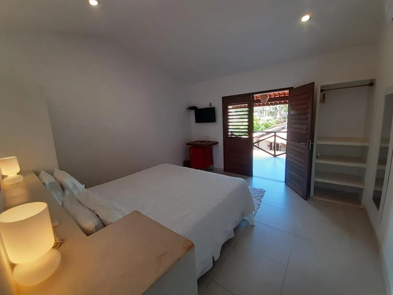 Bed in Recanto da Praia Pousada