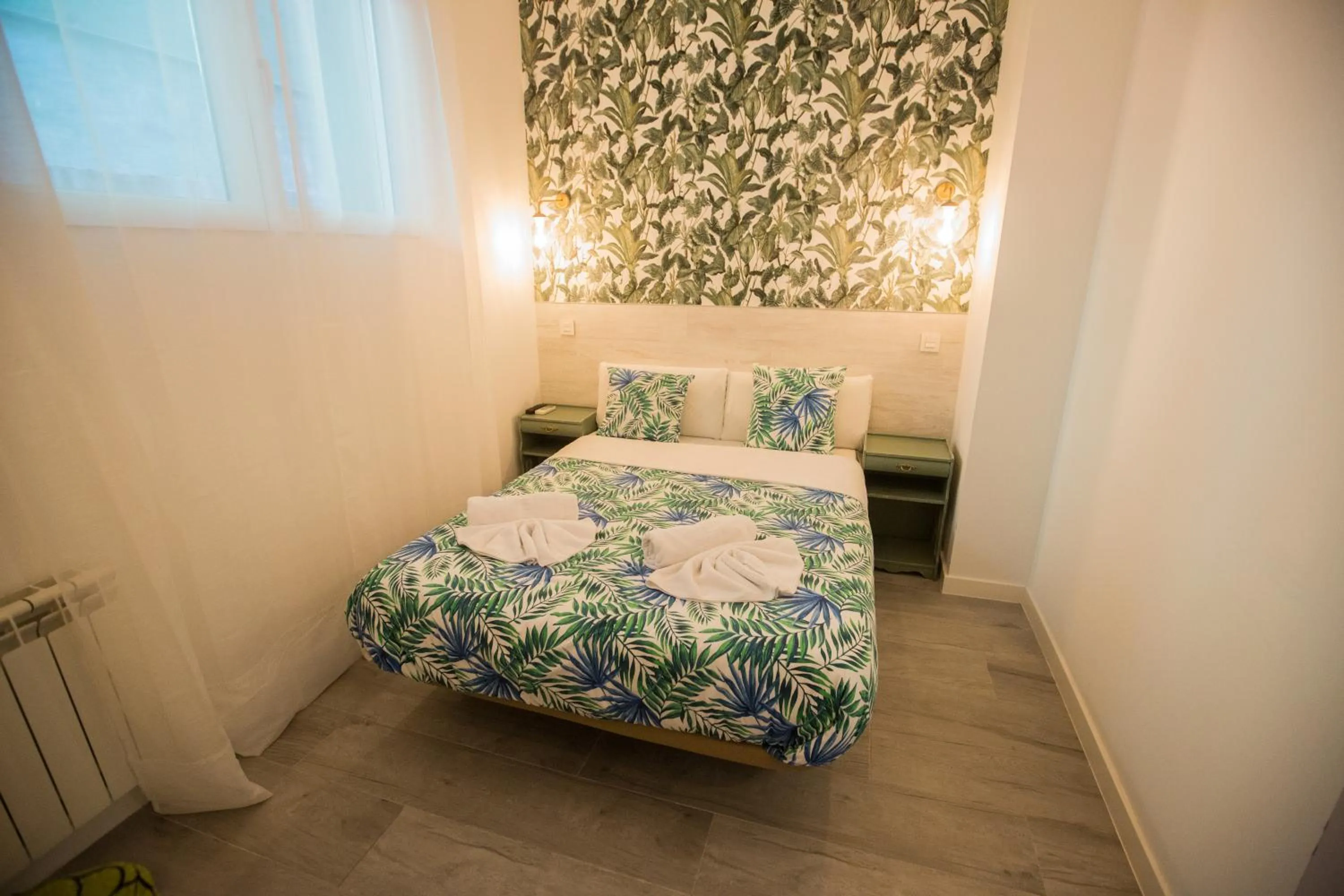 Bed in Hostal Escala Suites