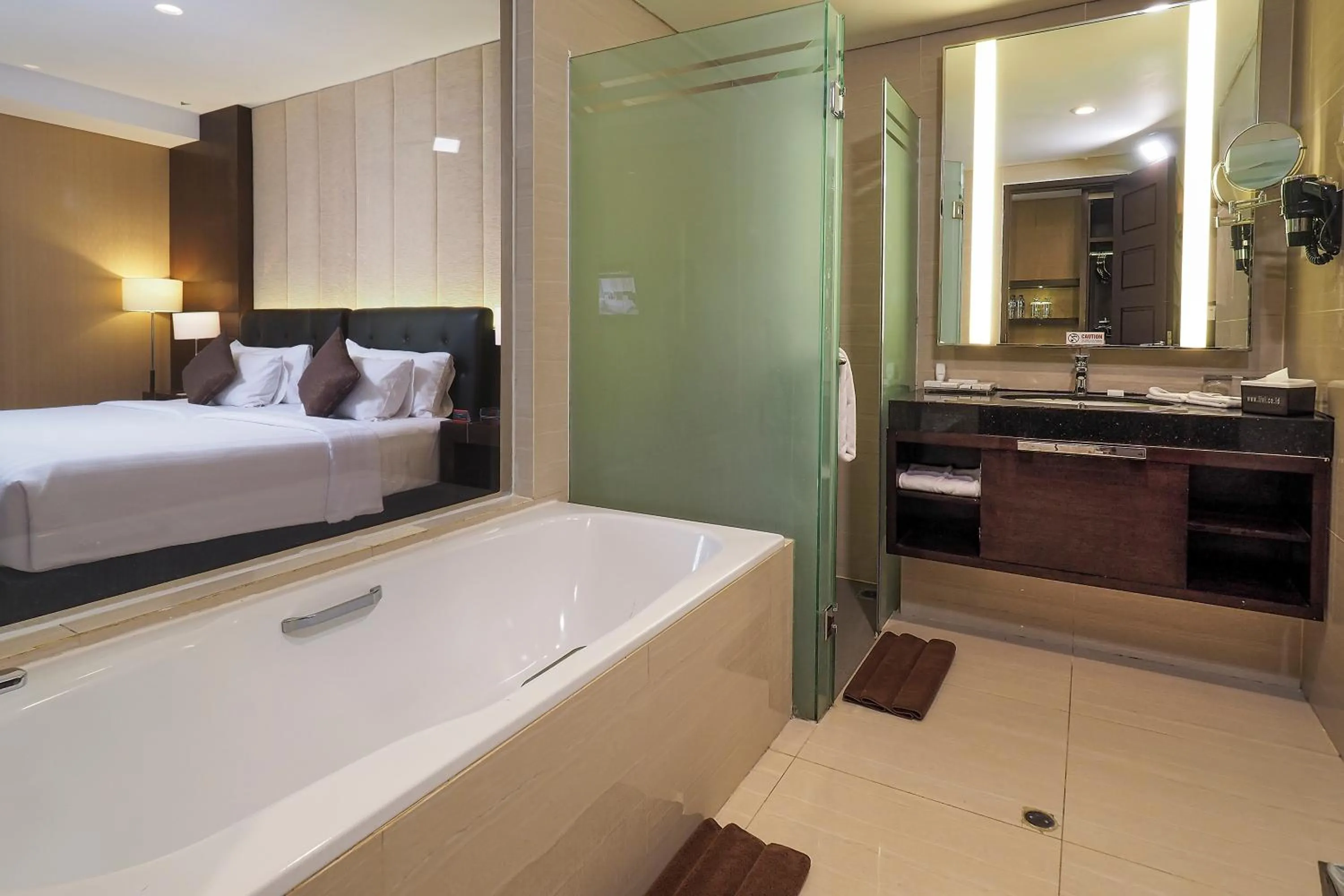 Bathroom, Bed in Grand Mercure Solo Baru