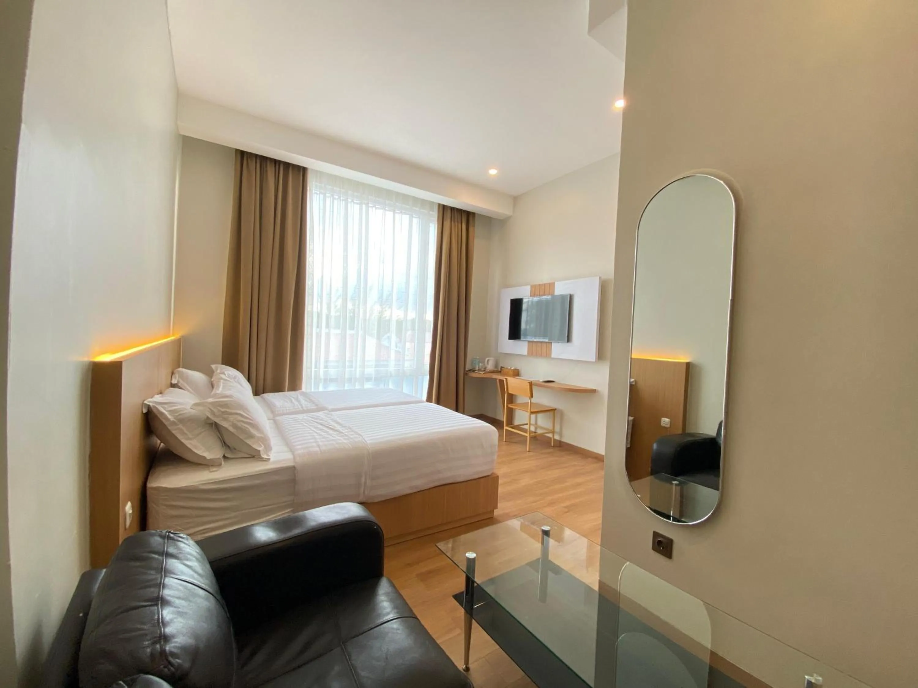 Bed in Garuda Hotel By Calandra