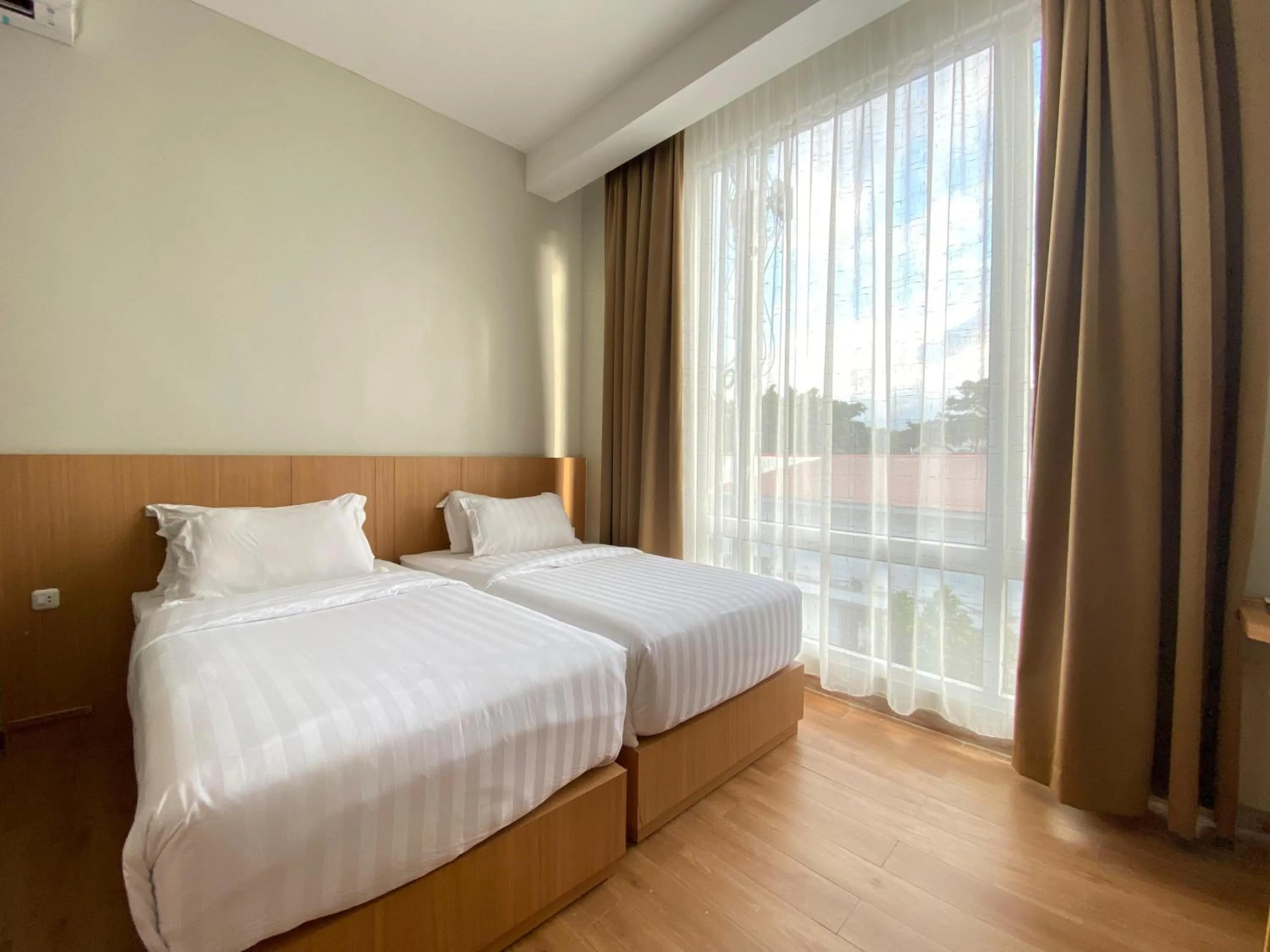 Bed in Garuda Hotel By Calandra