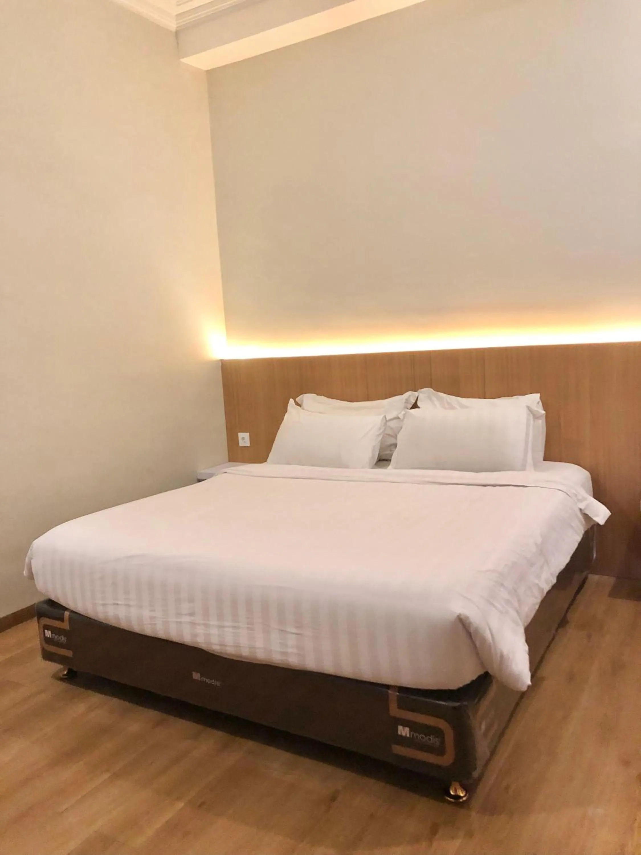 Bed in Garuda Hotel By Calandra