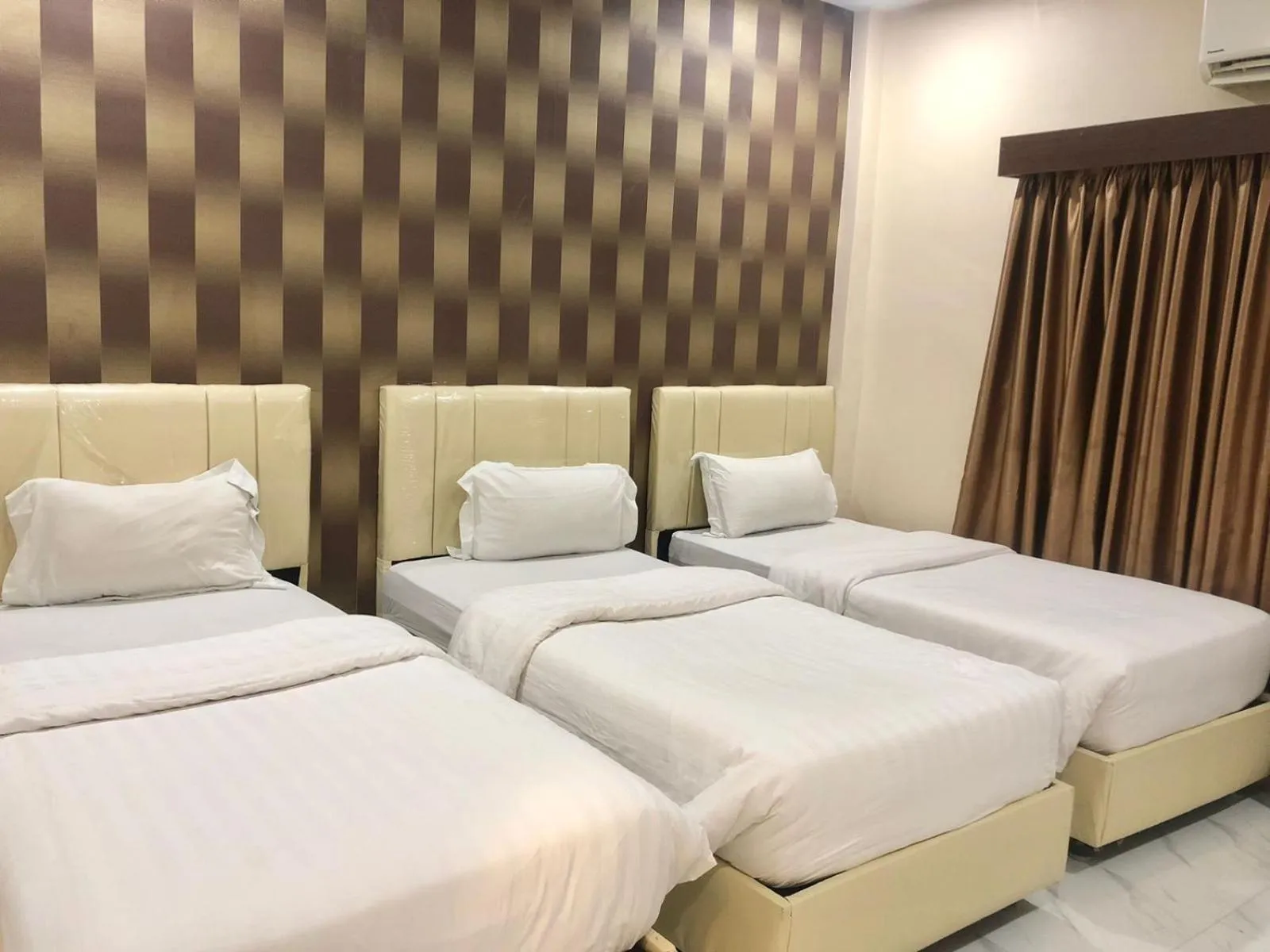 Bed in Garuda Hotel By Calandra