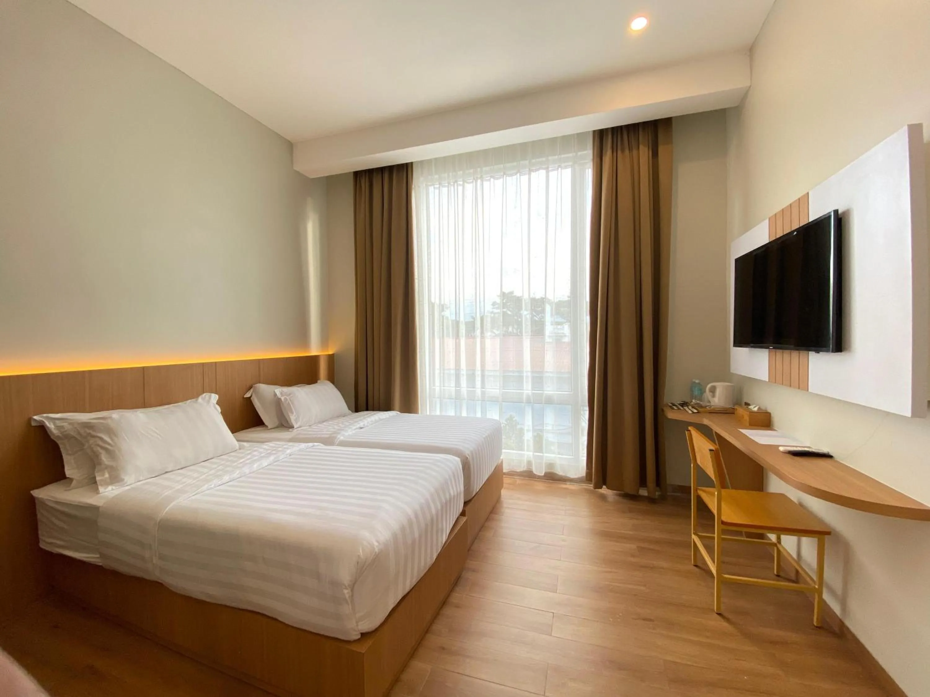 Bed in Garuda Hotel By Calandra