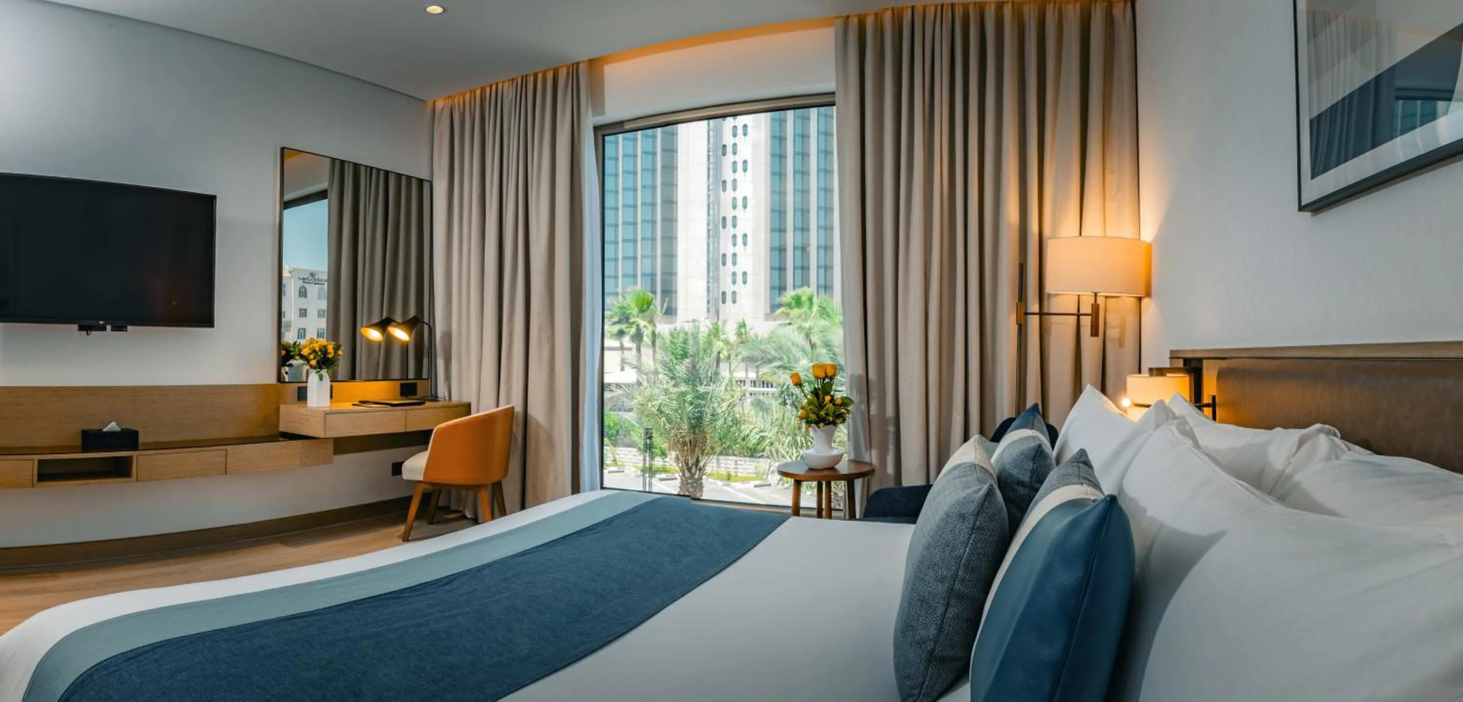 Bed in First Grand Hotel