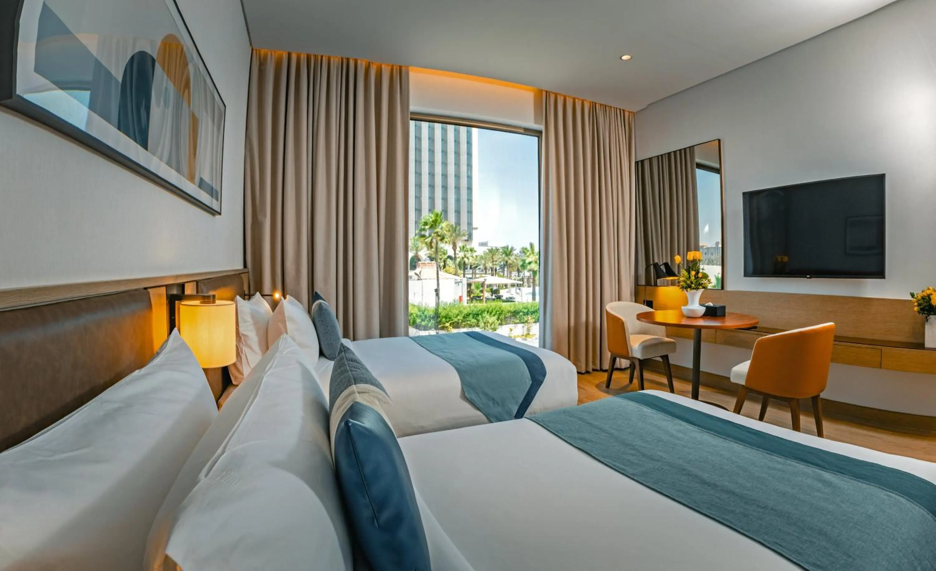 Bed in First Grand Hotel