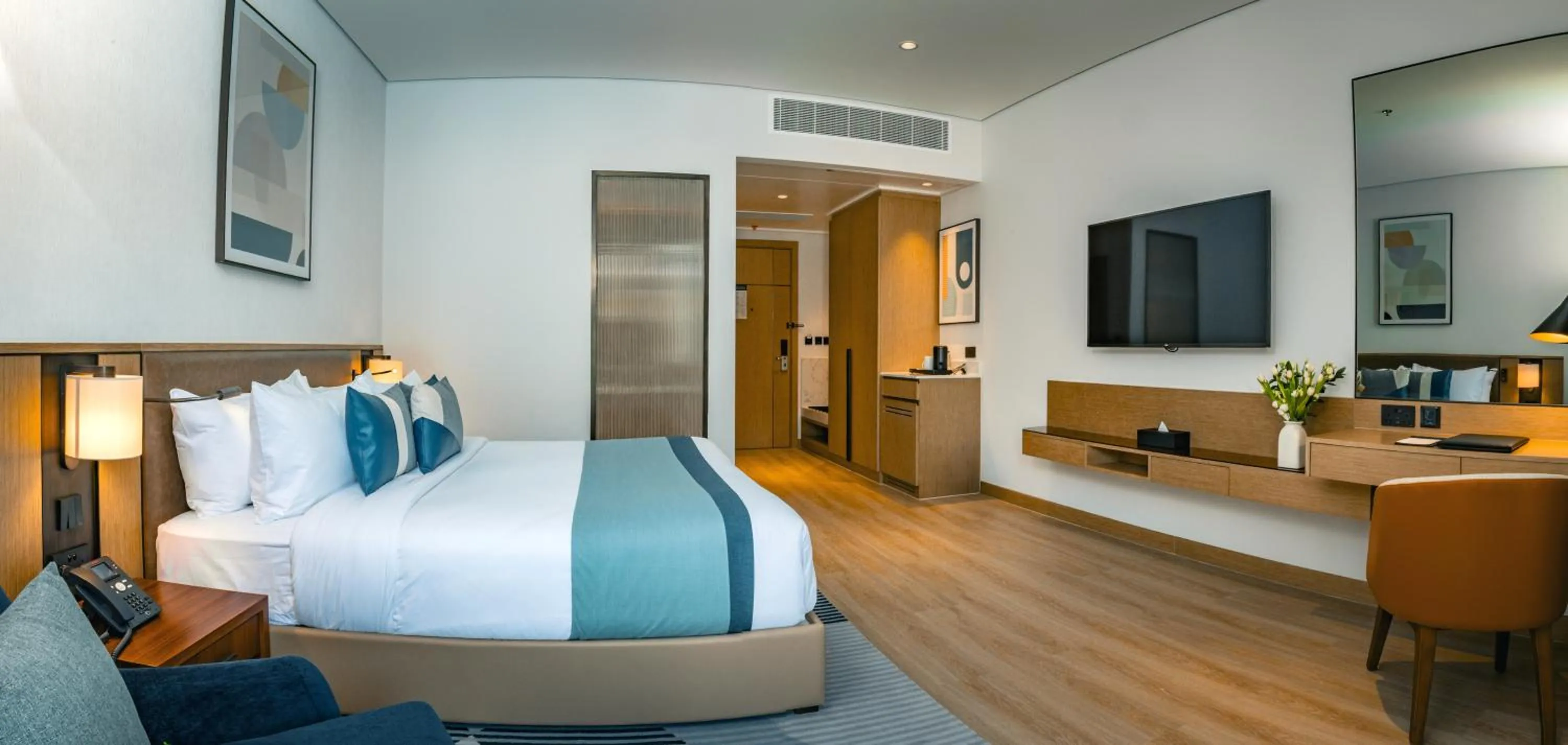 Bed in First Grand Hotel