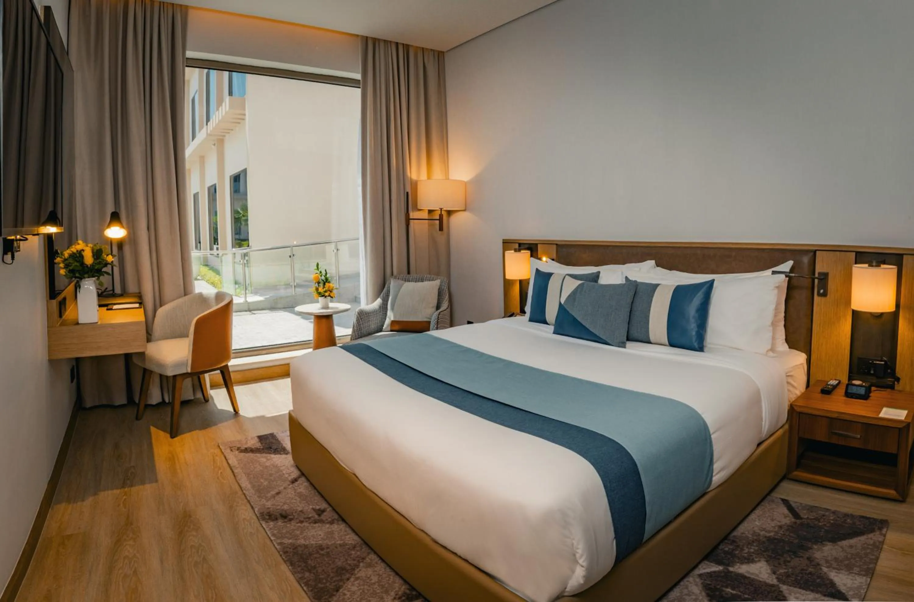 Bed in First Grand Hotel