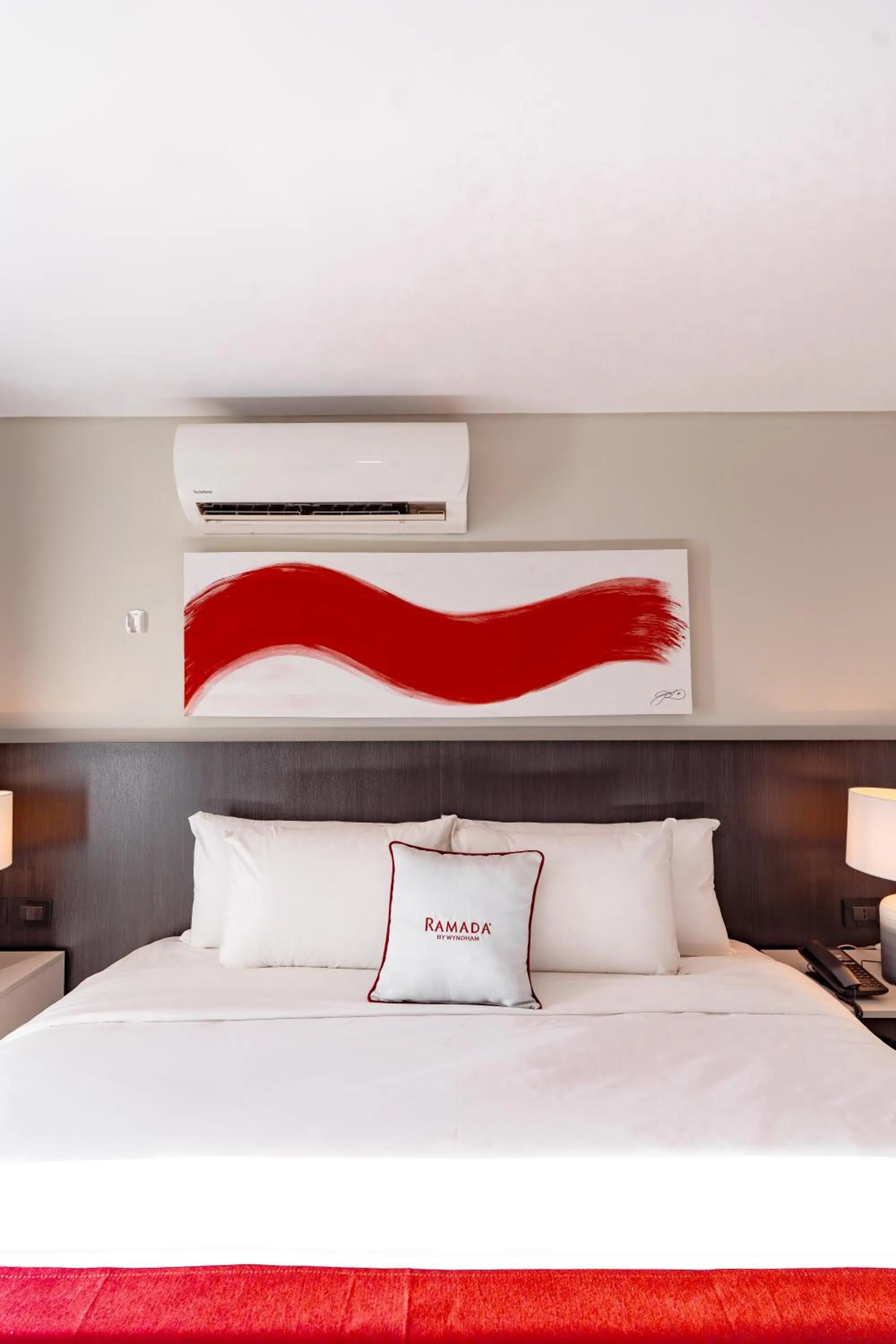 Bed in Ramada Suites by Wyndham Asuncion Aeropuerto