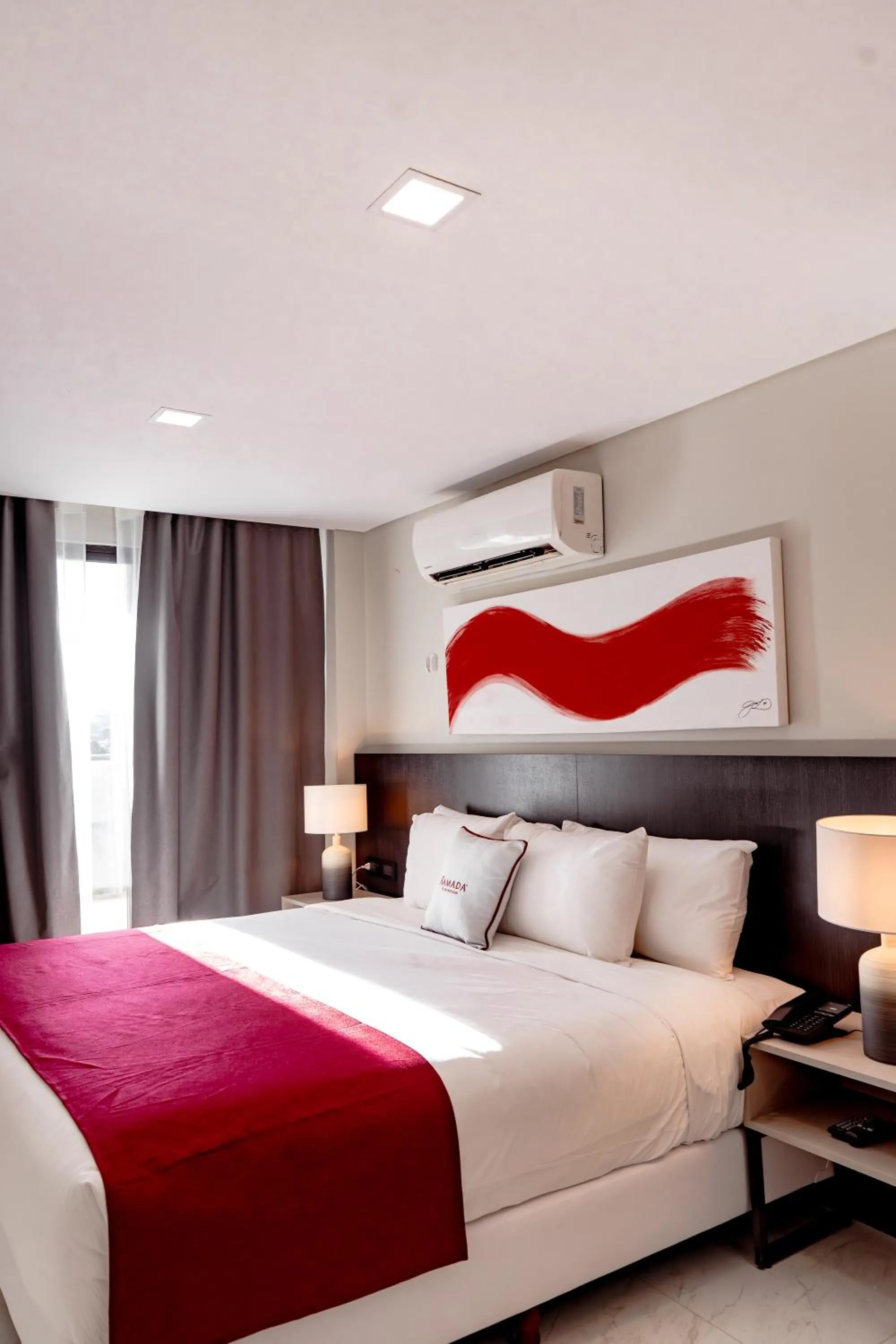 Bed in Ramada Suites by Wyndham Asuncion Aeropuerto