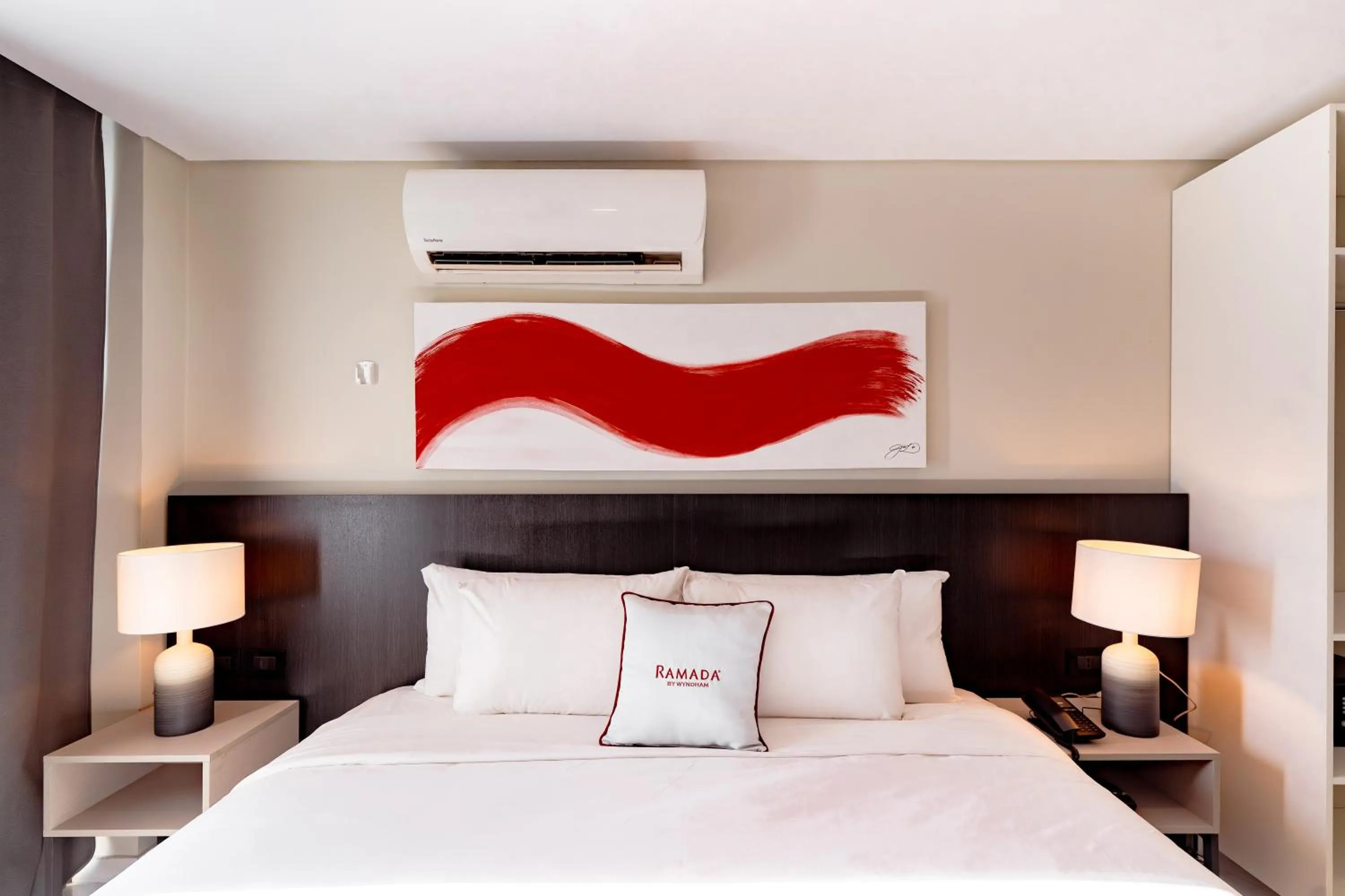 Bed in Ramada Suites by Wyndham Asuncion Aeropuerto