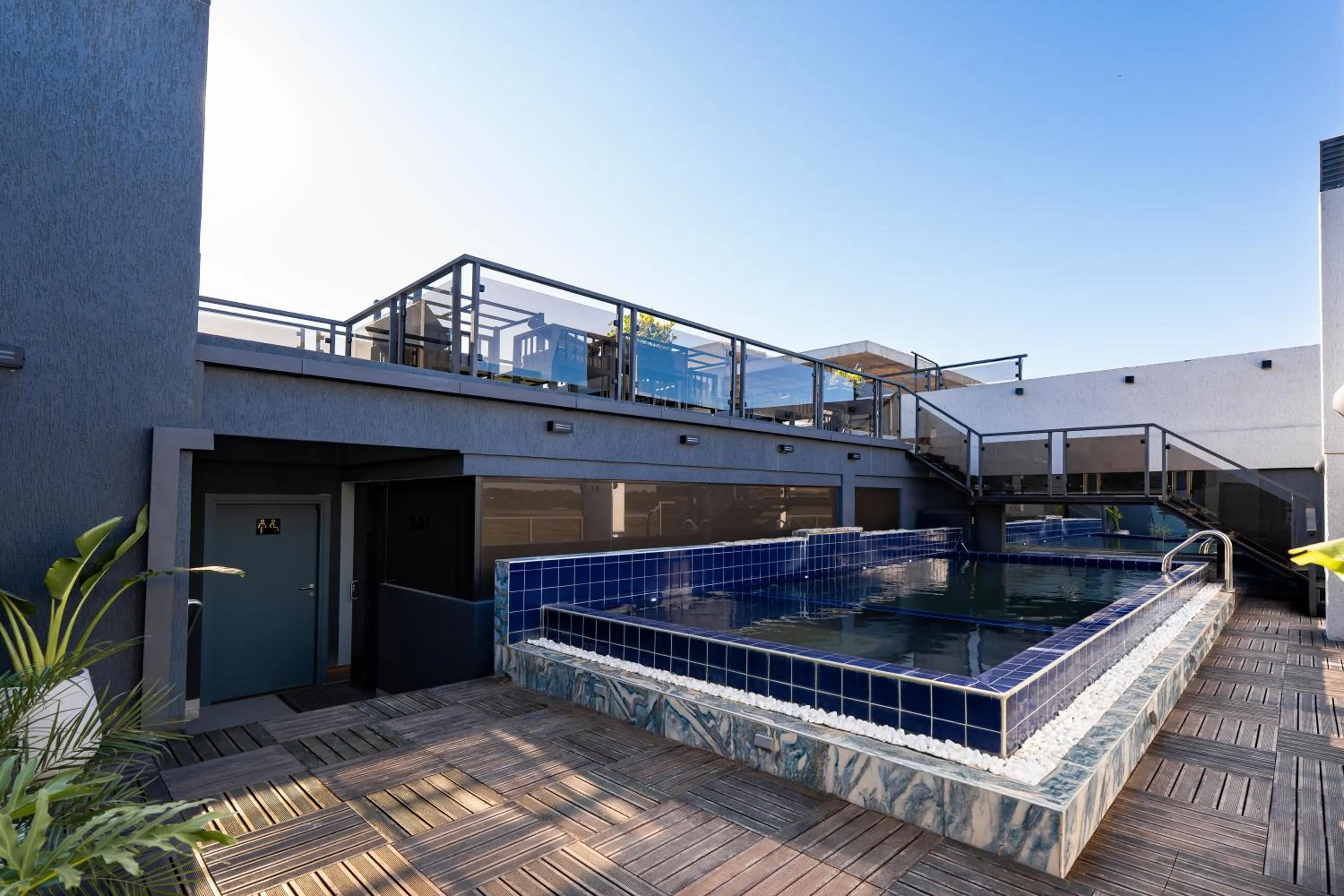 Swimming pool in Ramada Suites by Wyndham Asuncion Aeropuerto