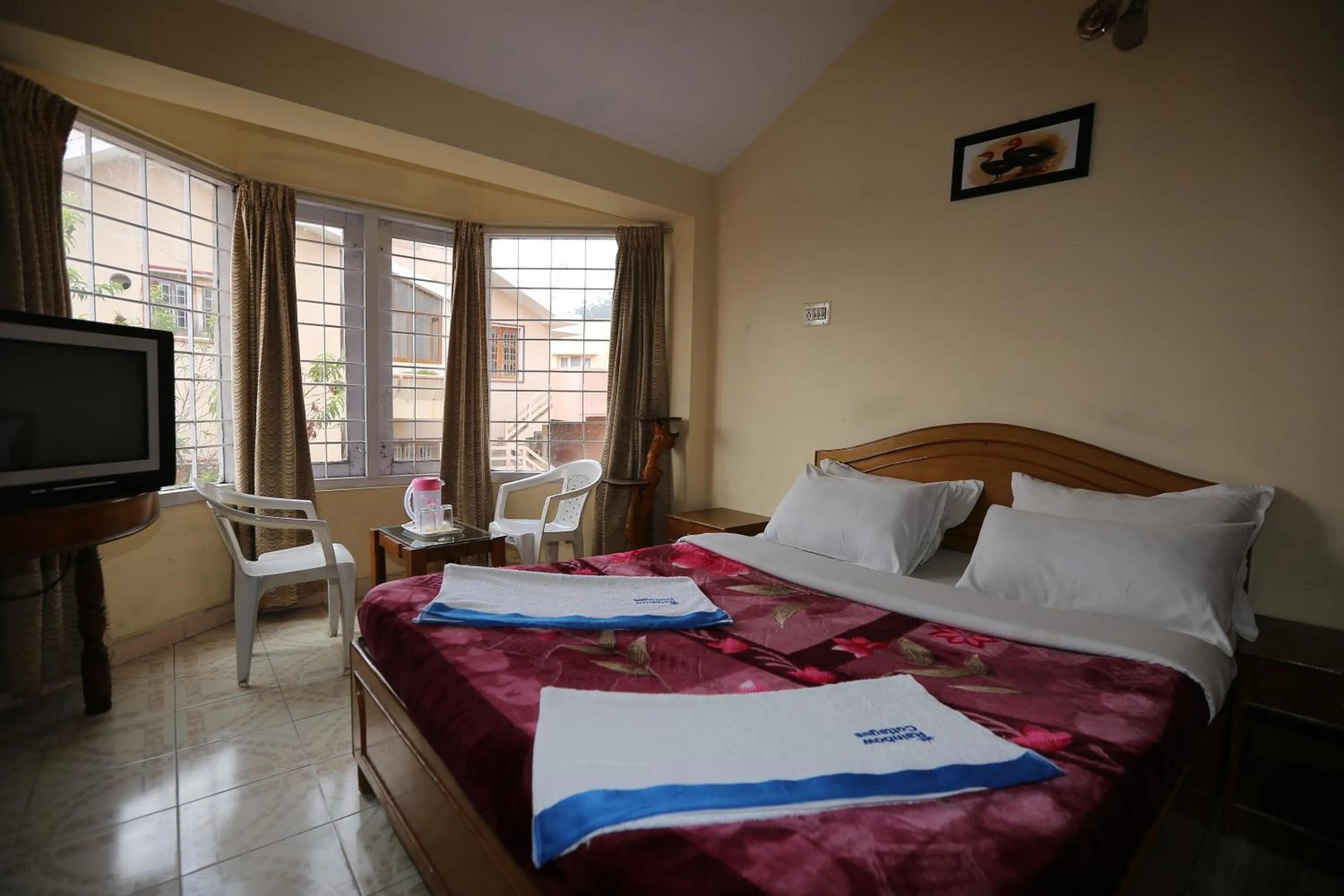 Day, Bed in Rainbow Cottages-Budget Friendly rooms