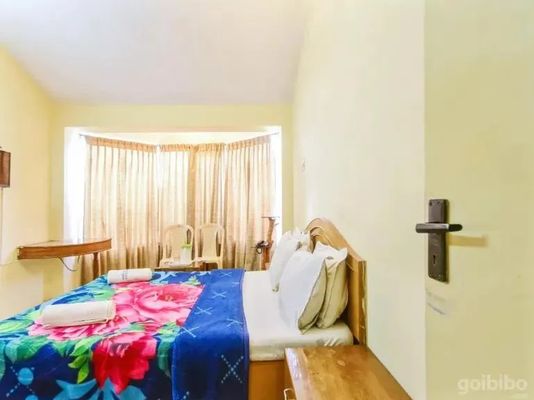 Bed in Rainbow Cottages-Budget Friendly rooms