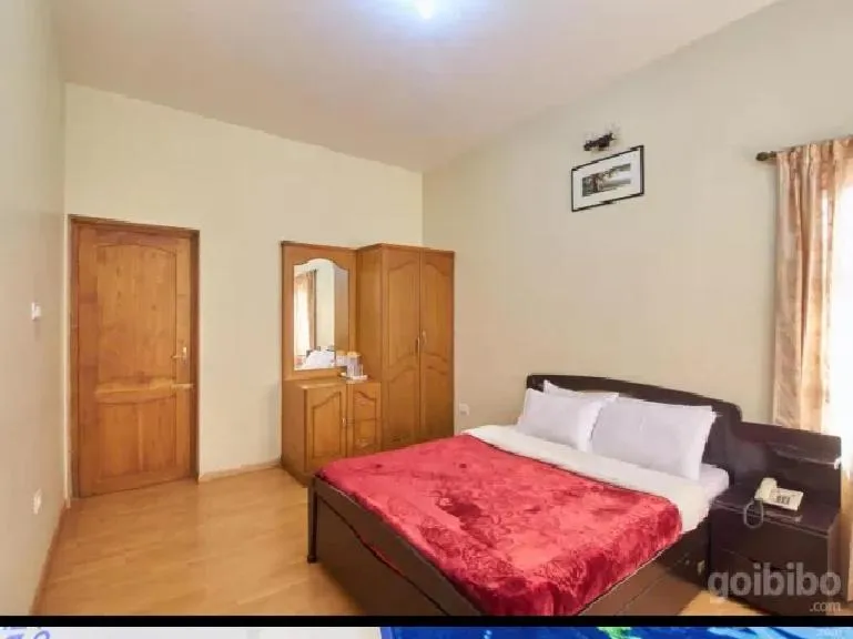 Bed in Rainbow Cottages-Budget Friendly rooms