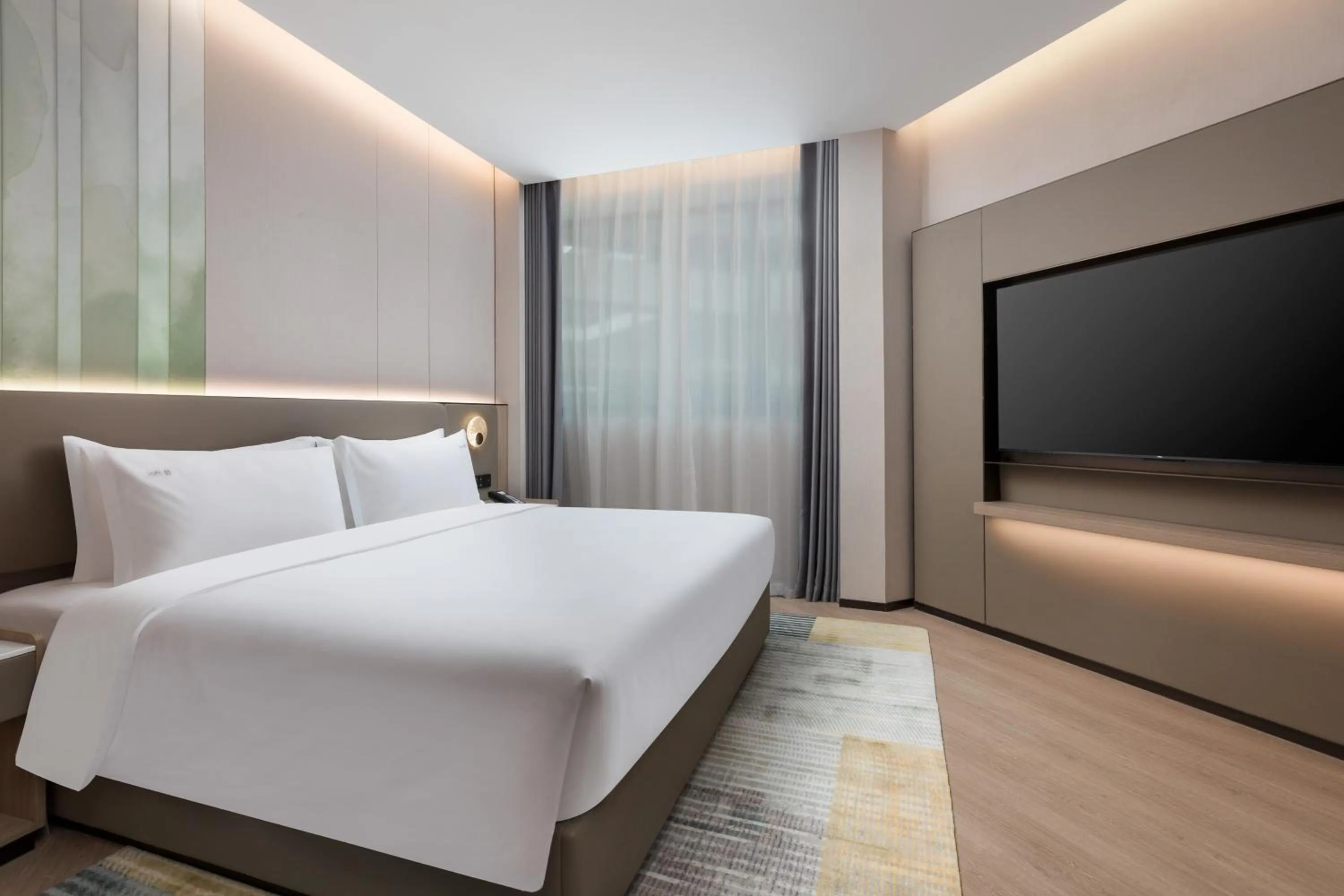 Bed in Holiday Inn & Suites Shanghai Changfeng by IHG