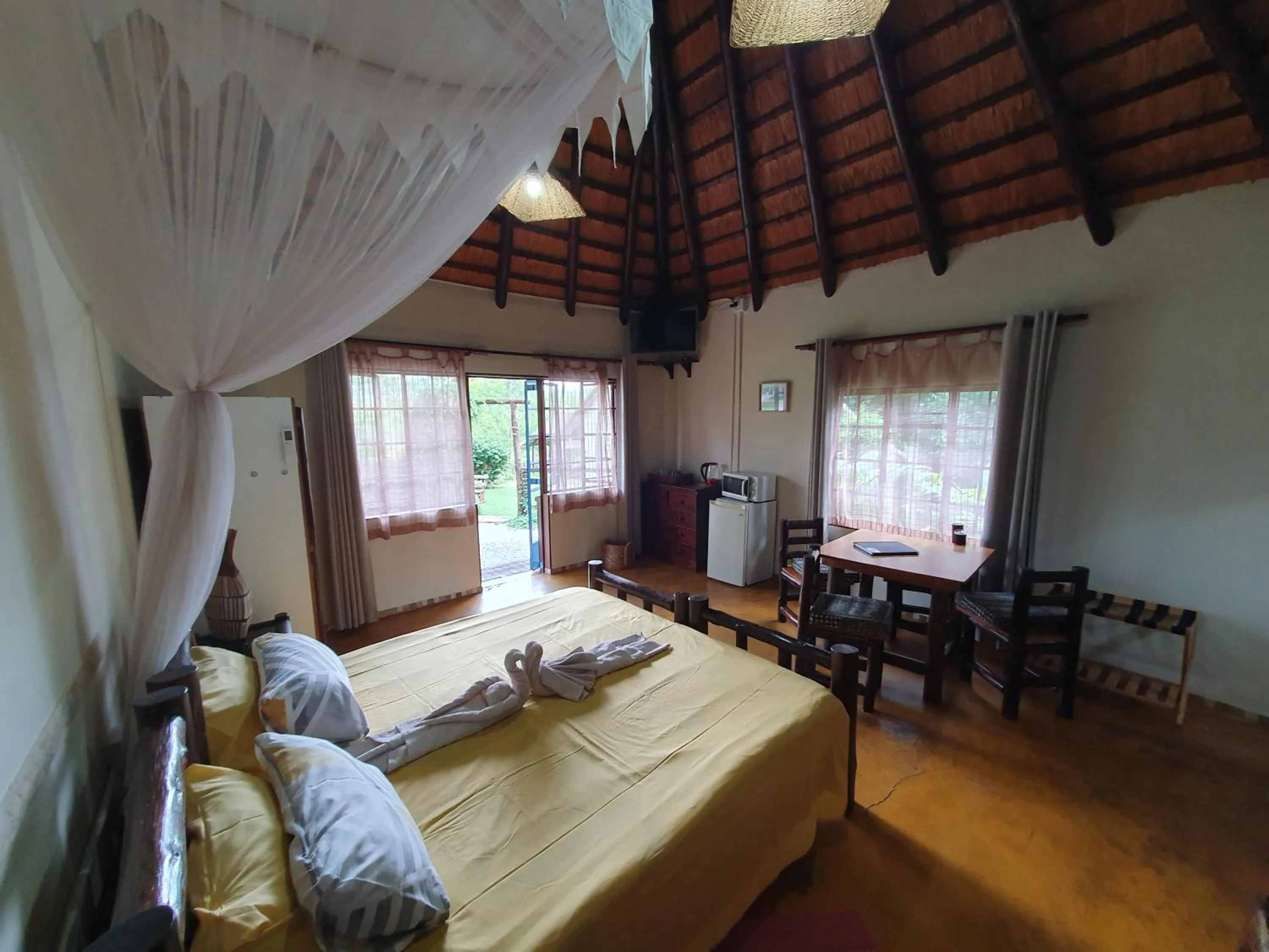Photo of the whole room, Bed in Thokozani Lodge