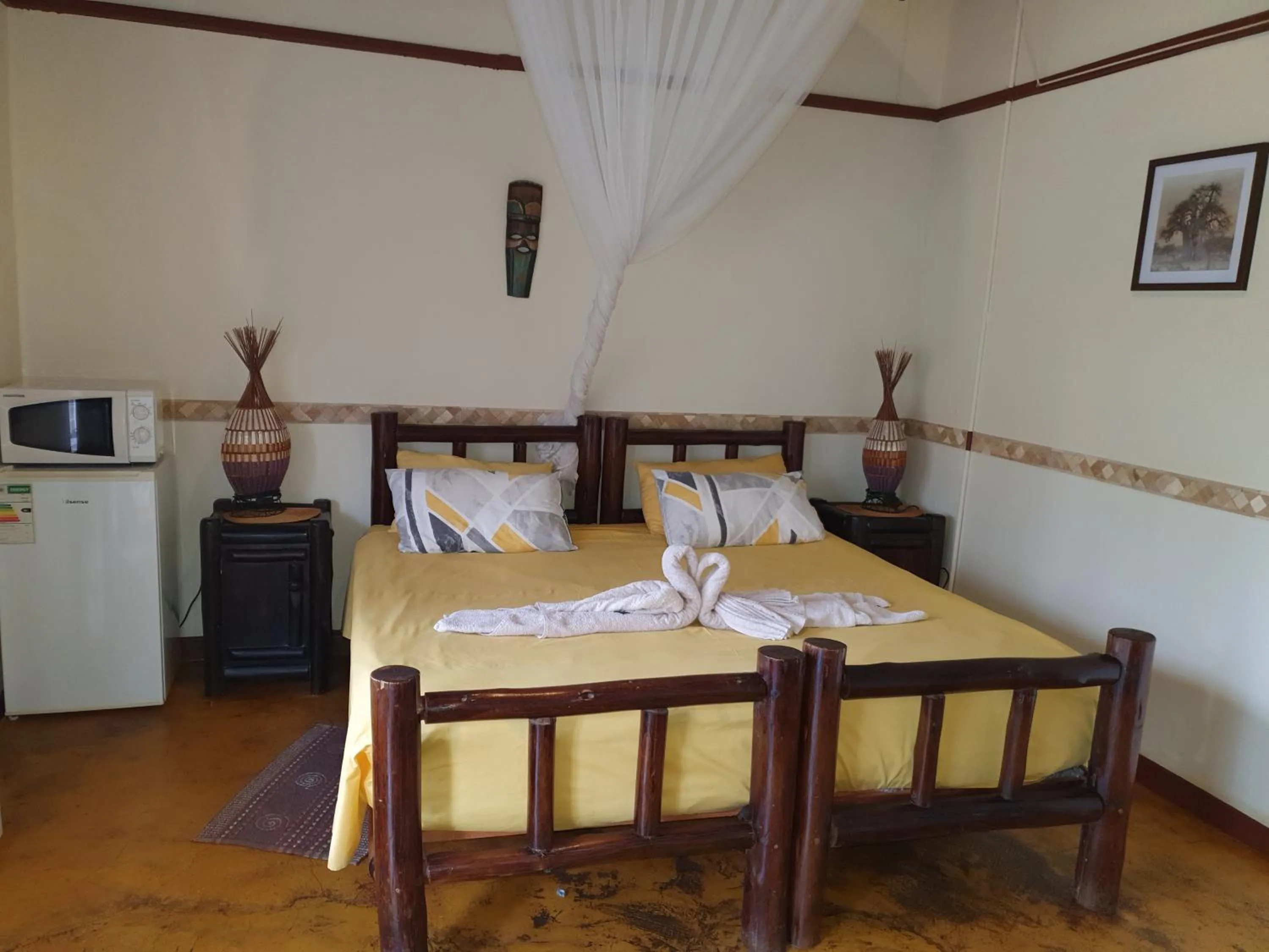 Photo of the whole room, Bed in Thokozani Lodge