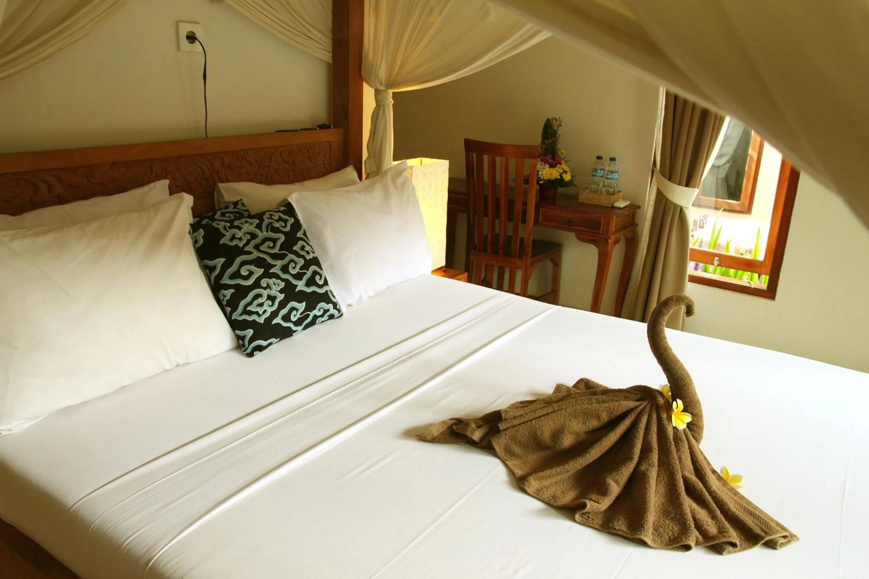 Bed in Suryadina Guest House