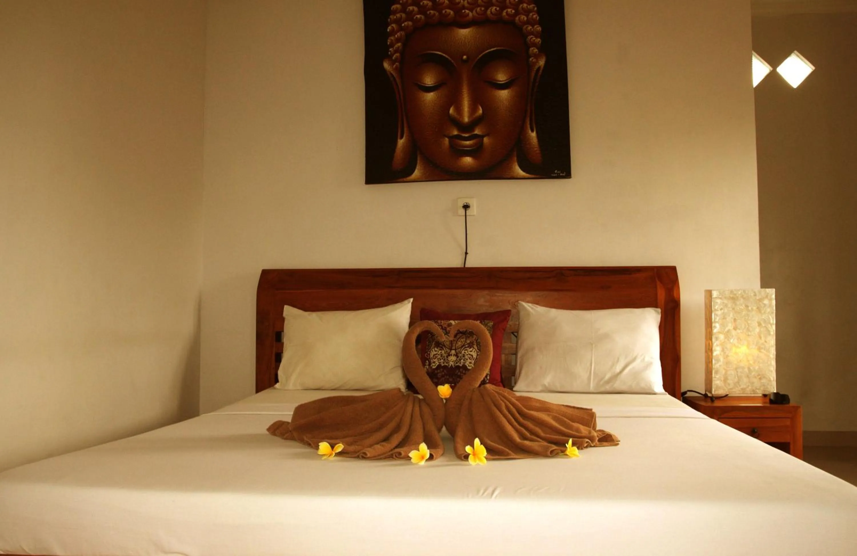 Bed in Suryadina Guest House