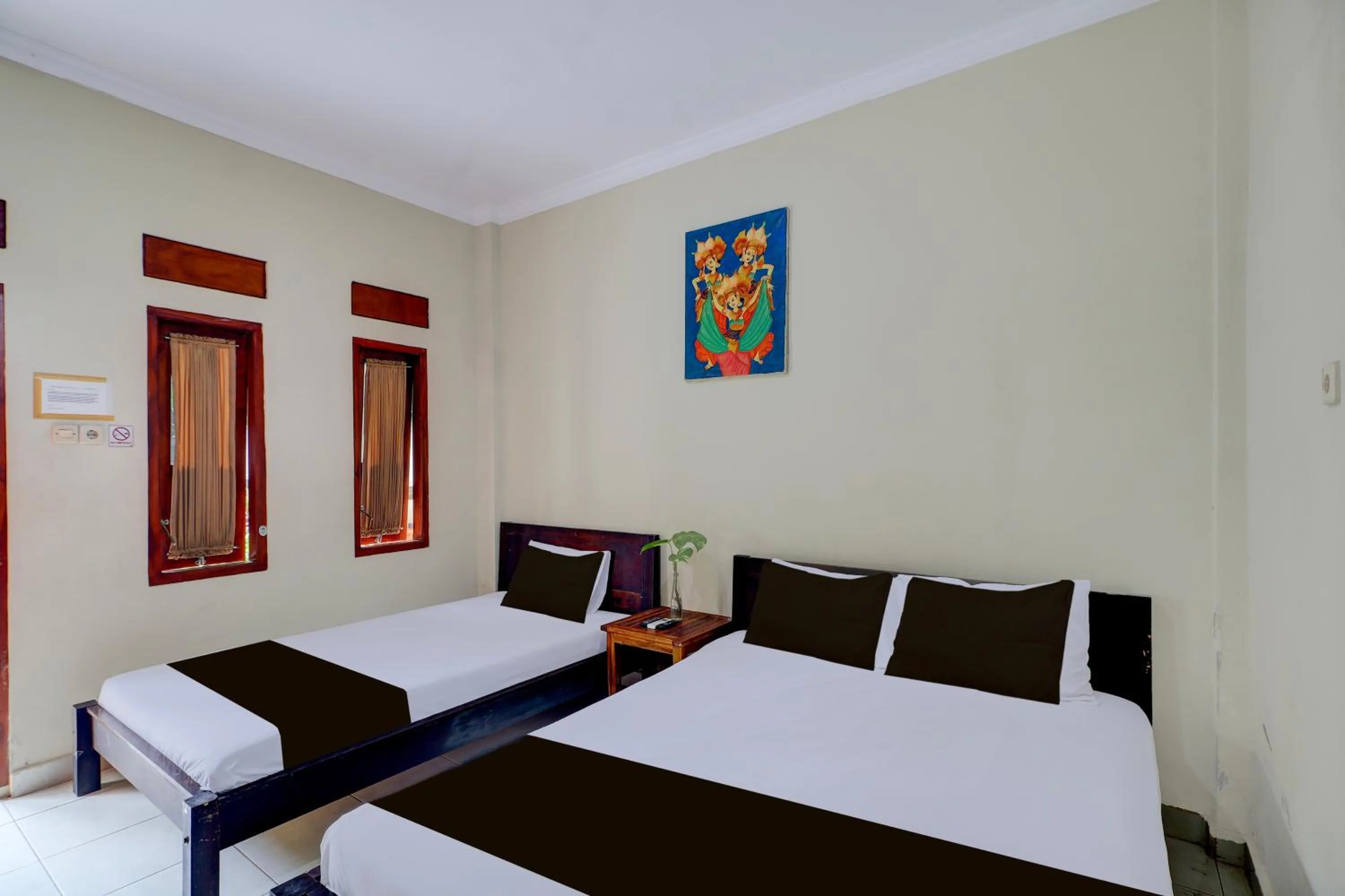 Photo of the whole room, Bed in Collection O Budget Door Legian Inn @Poppies Road