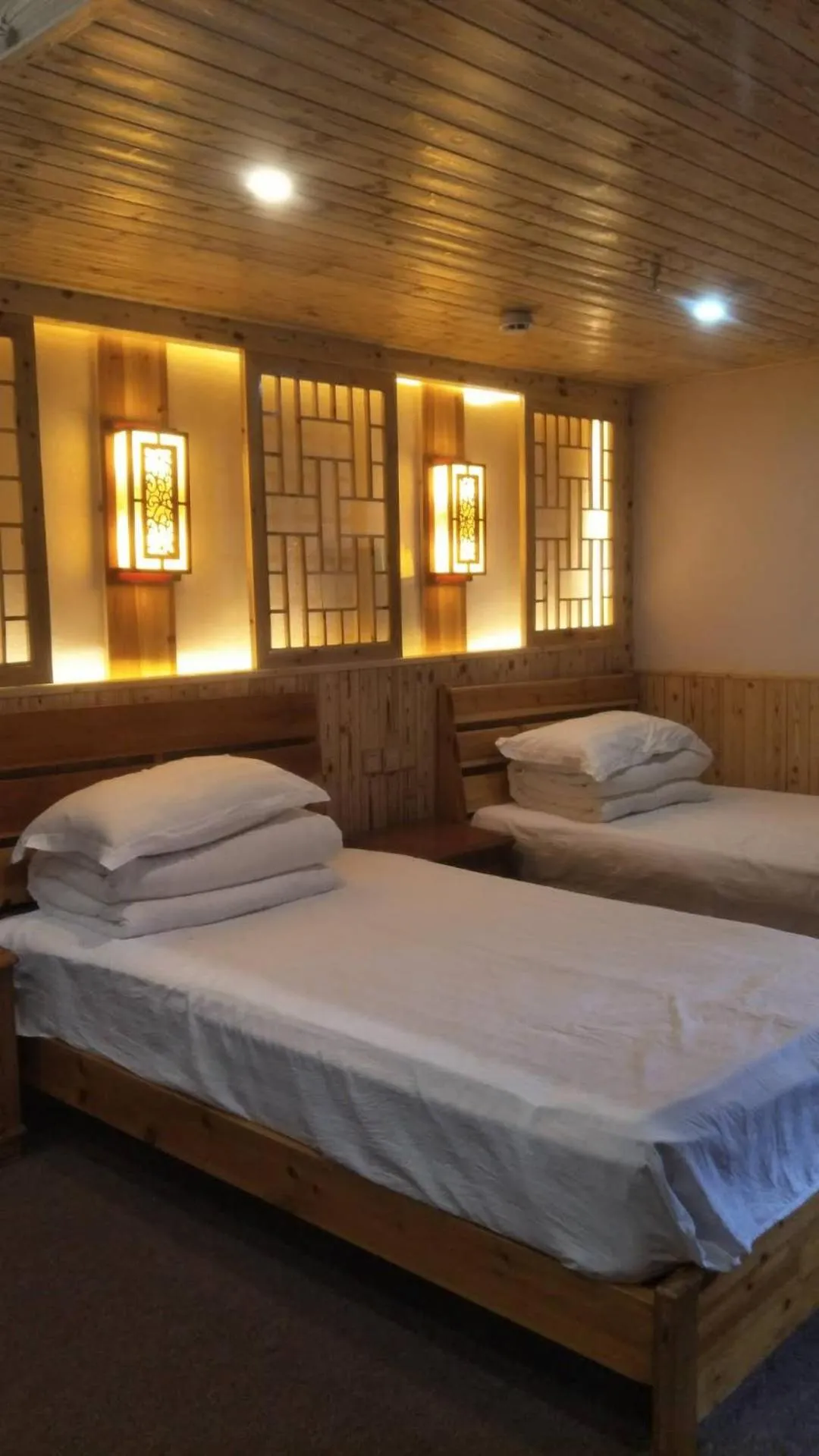 Bed in Nanjing Tulou Qingdelou Inn