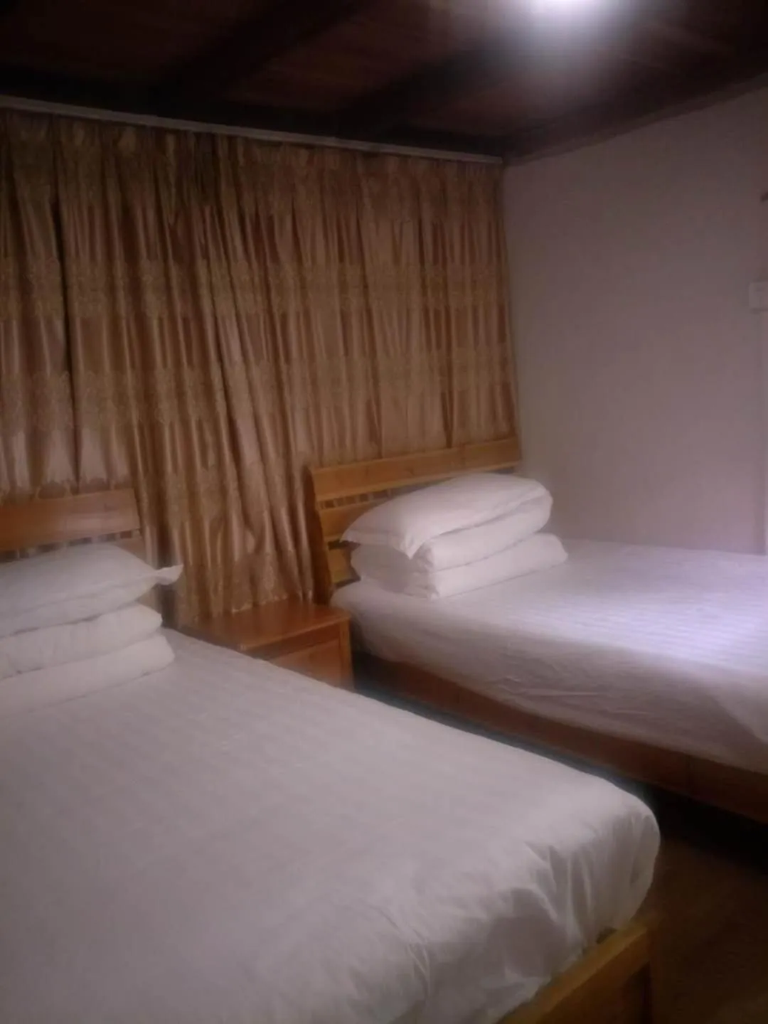 Bed in Nanjing Tulou Qingdelou Inn