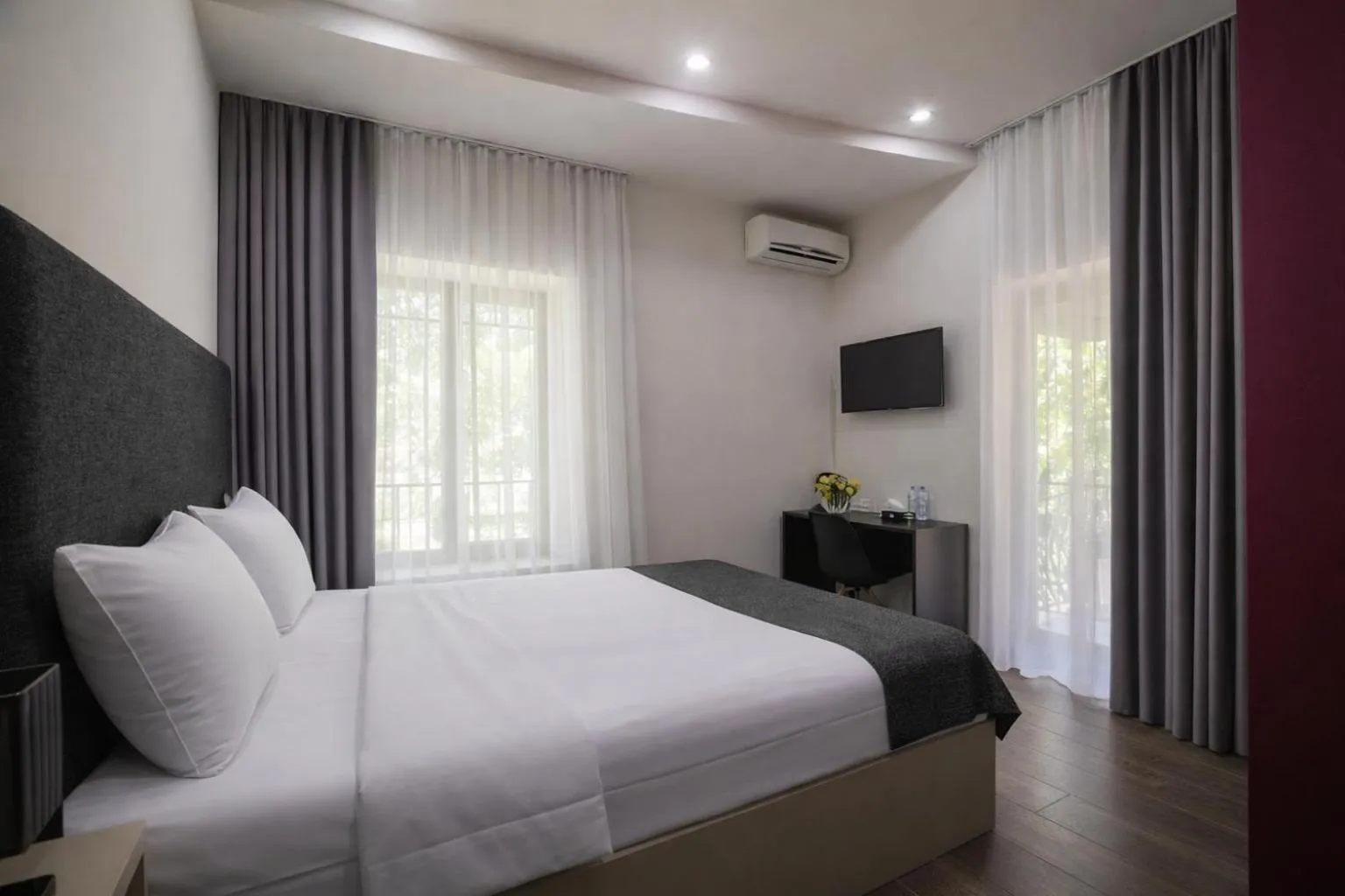 Bed in Elysium Gallery Hotel