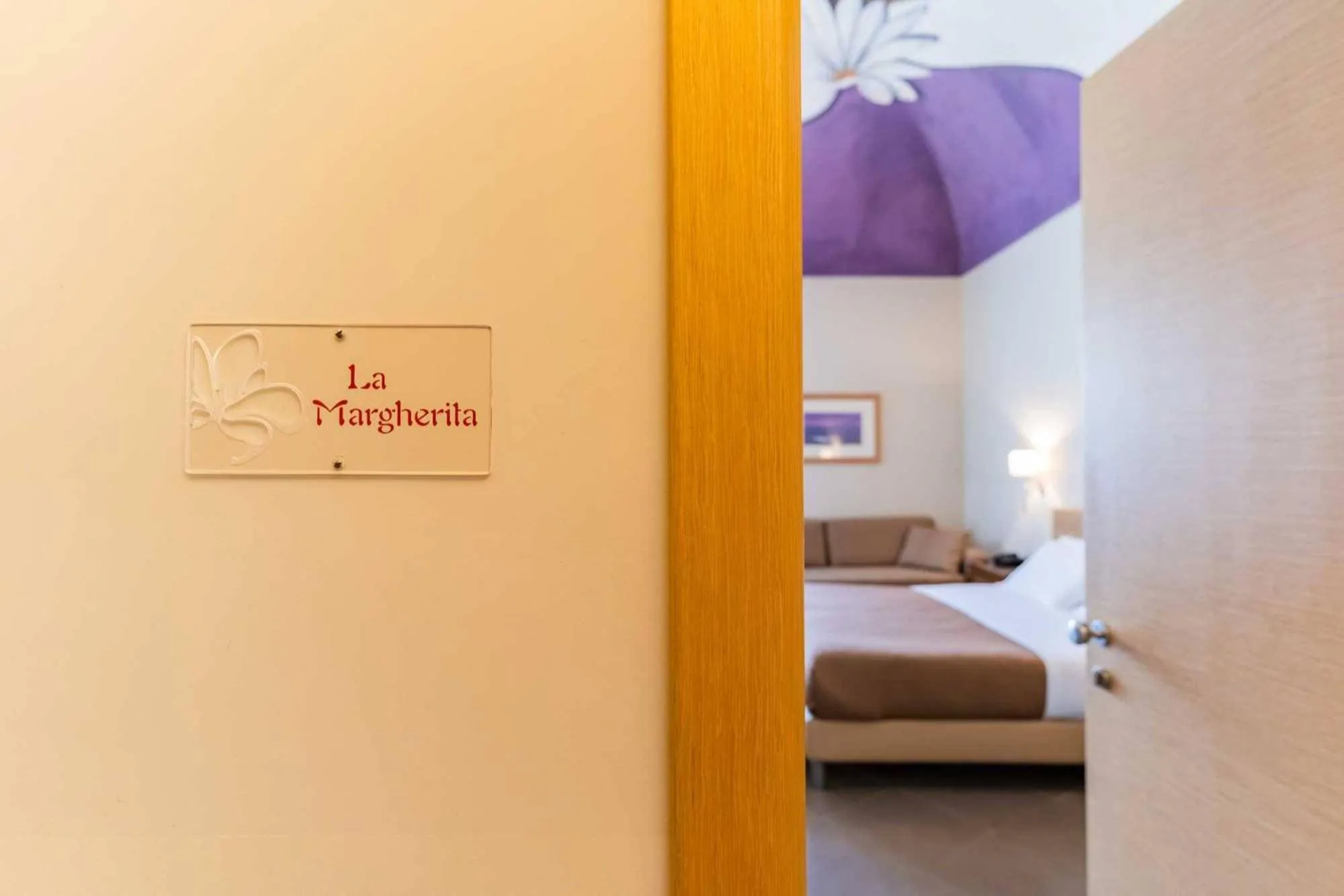 Bed in Le Magnolie Hotel