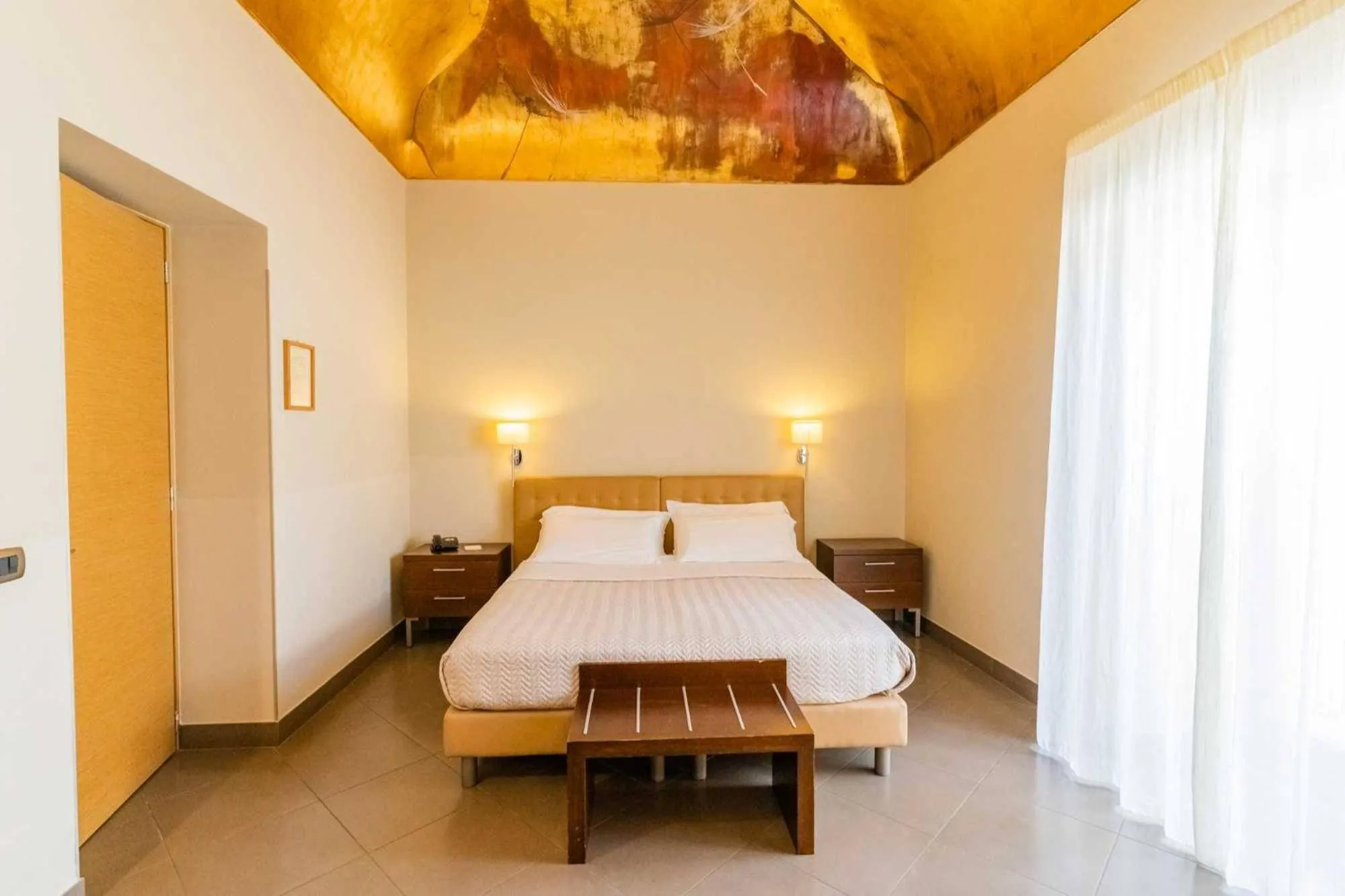 Bed in Le Magnolie Hotel