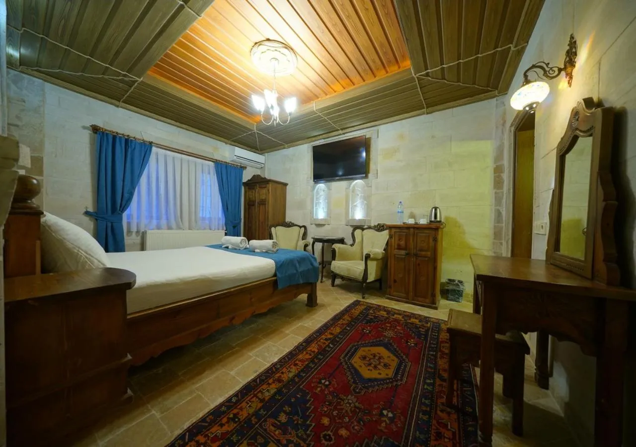 Bed in ShoeString Stone House