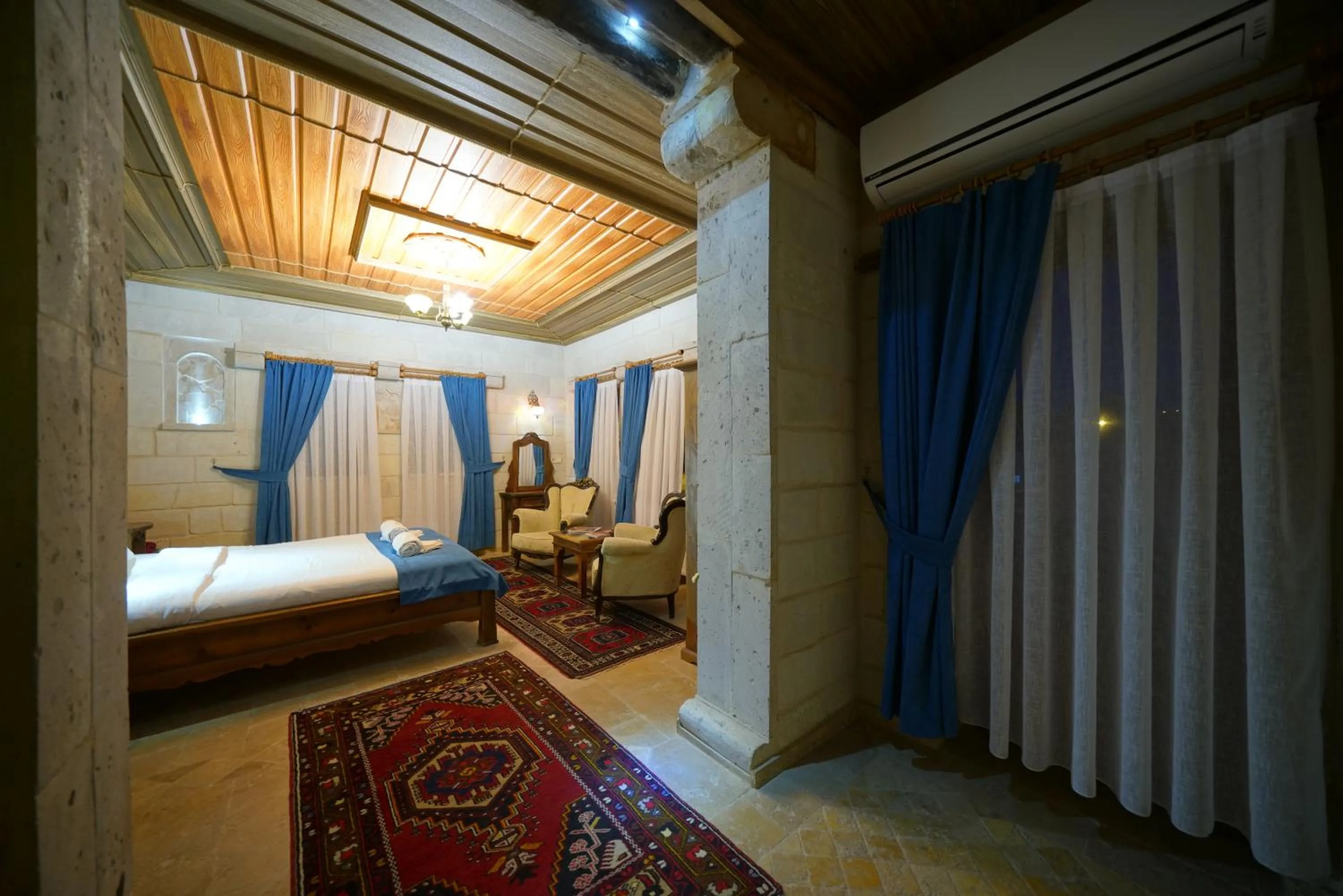 Bed in ShoeString Stone House