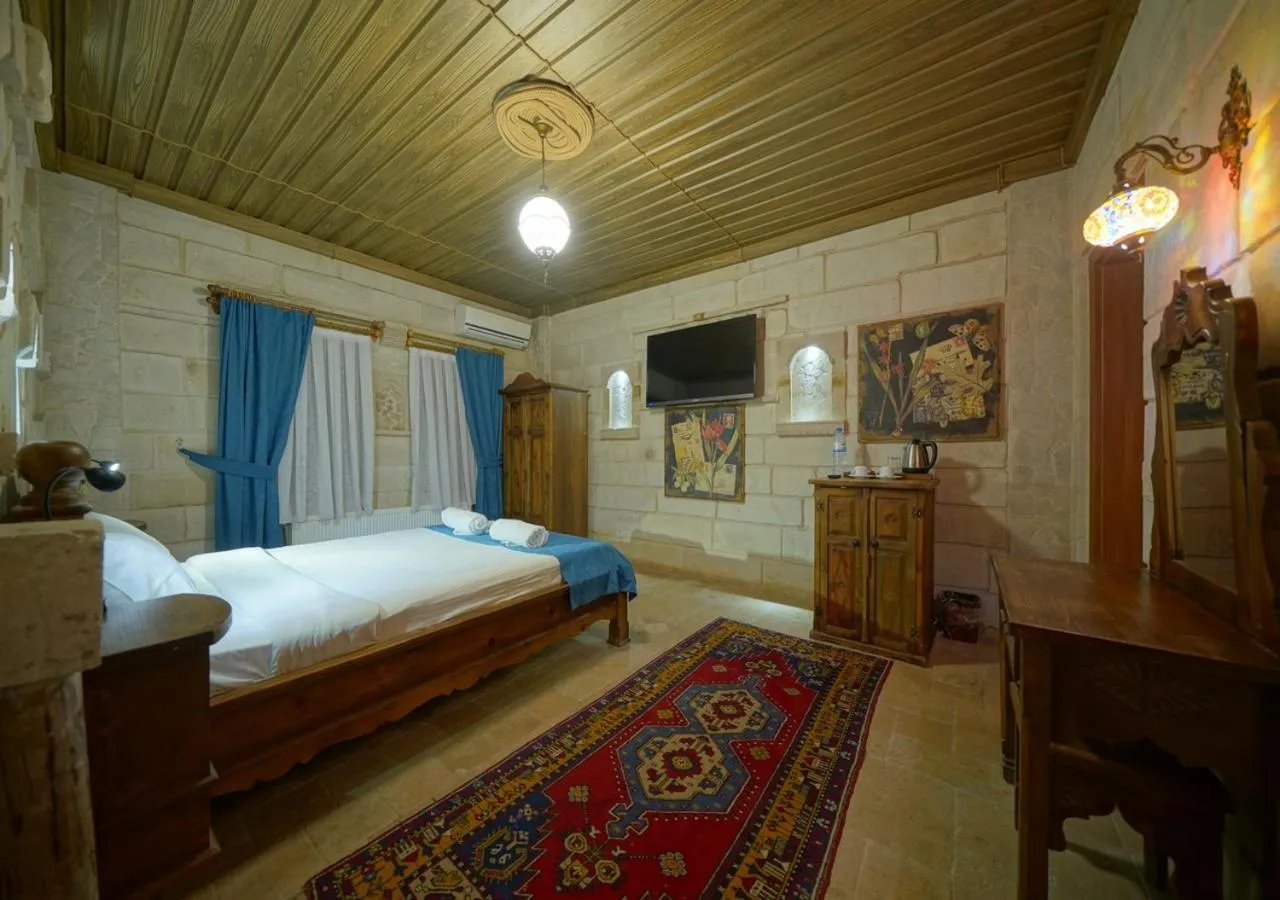 Bed in ShoeString Stone House