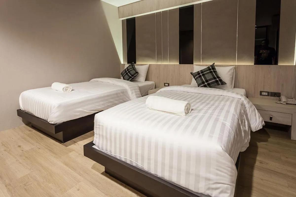 Bed in Kesorn Boutique Hotel