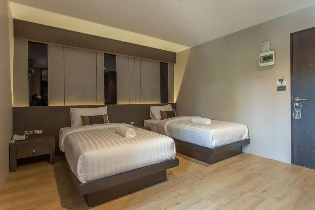 Bed in Kesorn Boutique Hotel