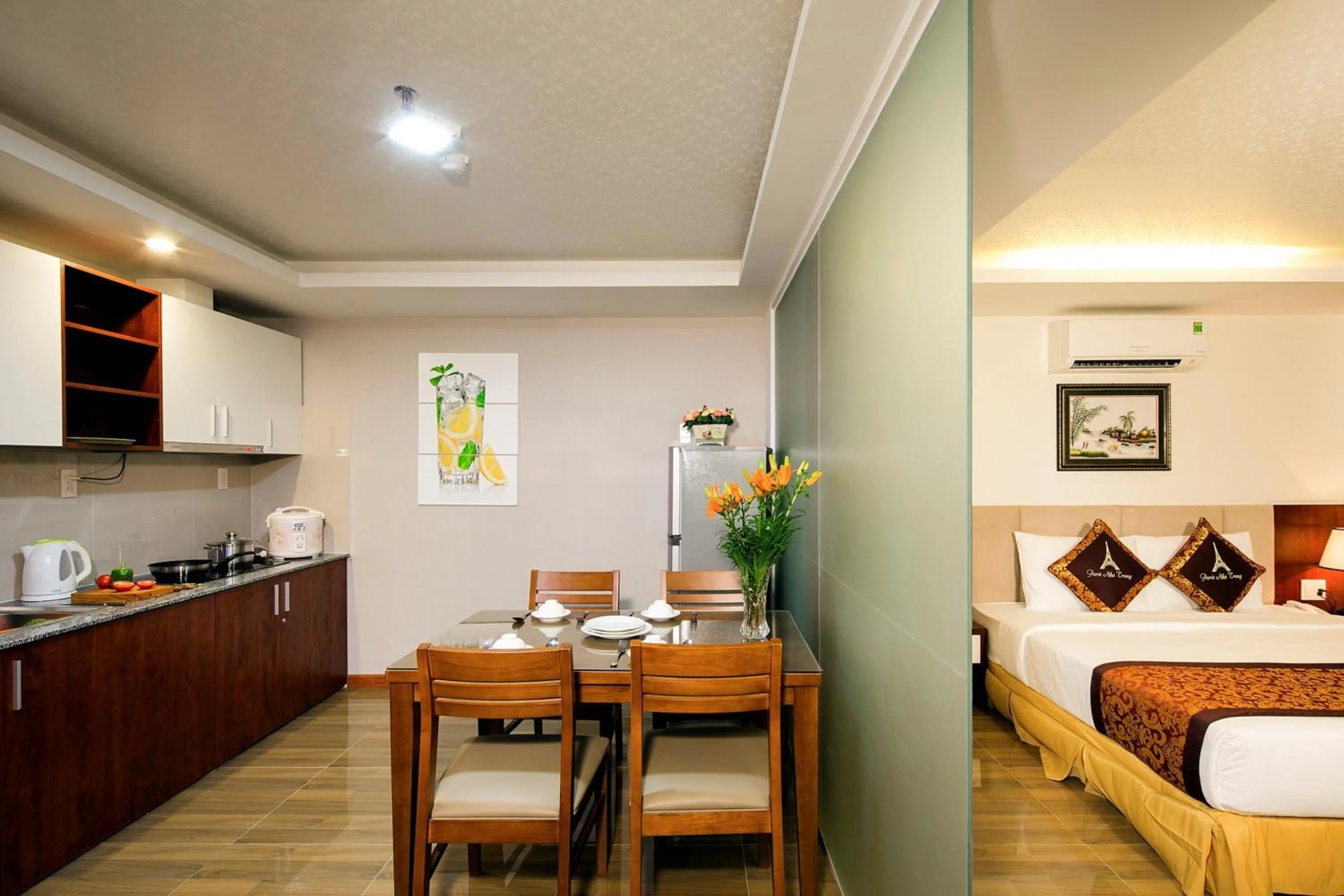 Kitchen or kitchenette, Bed in Paris Luxury Hotel & Apartment Nha Trang