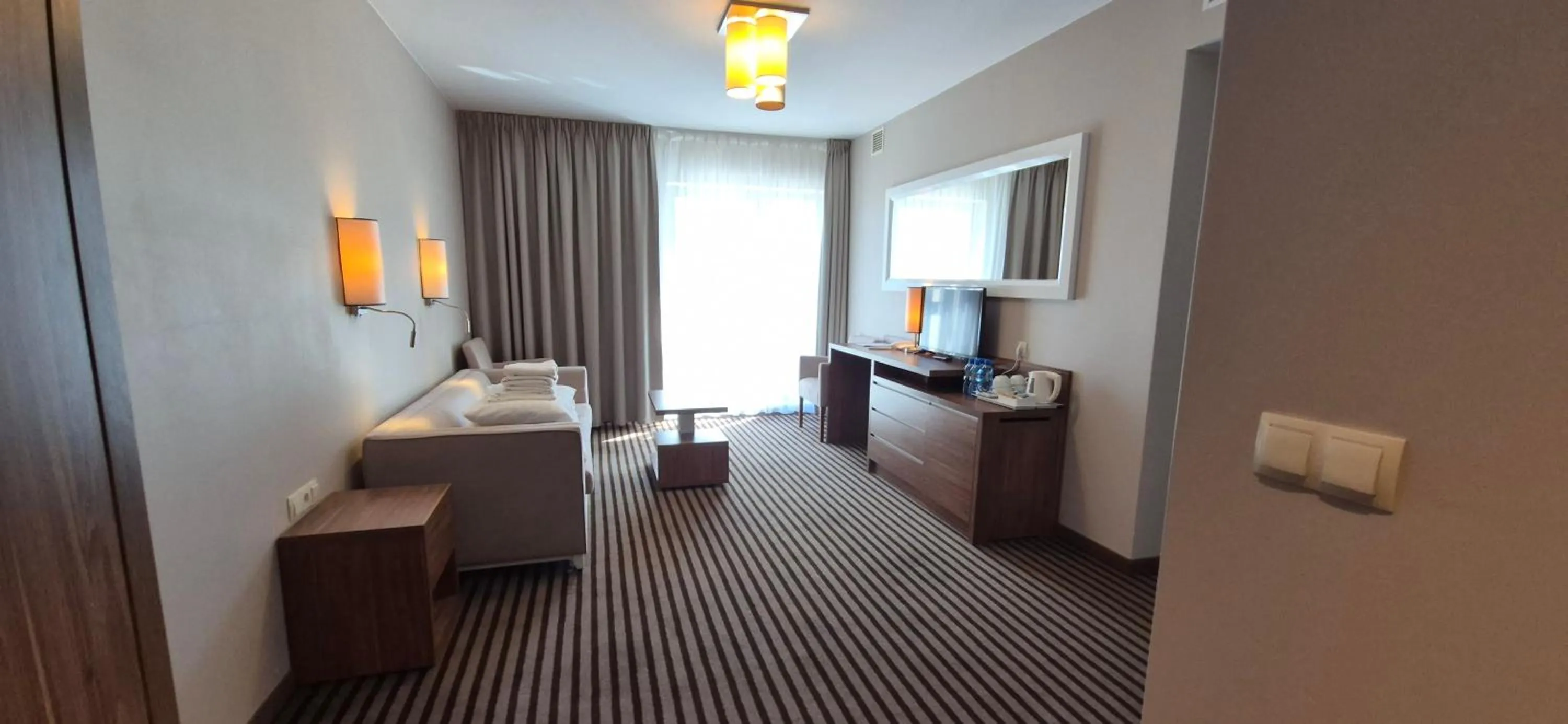 Seating area, Bed in Hotel White