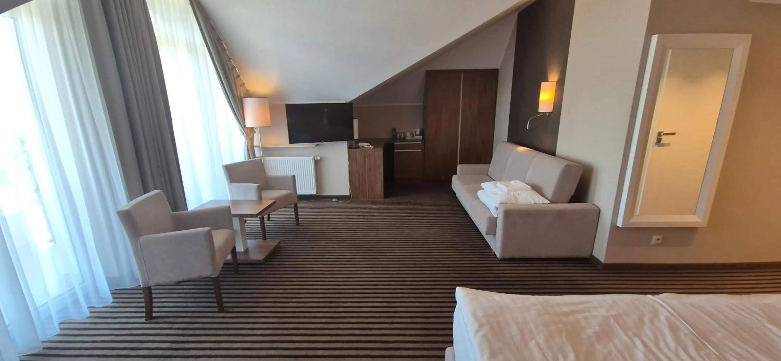 Seating area, Bed in Hotel White