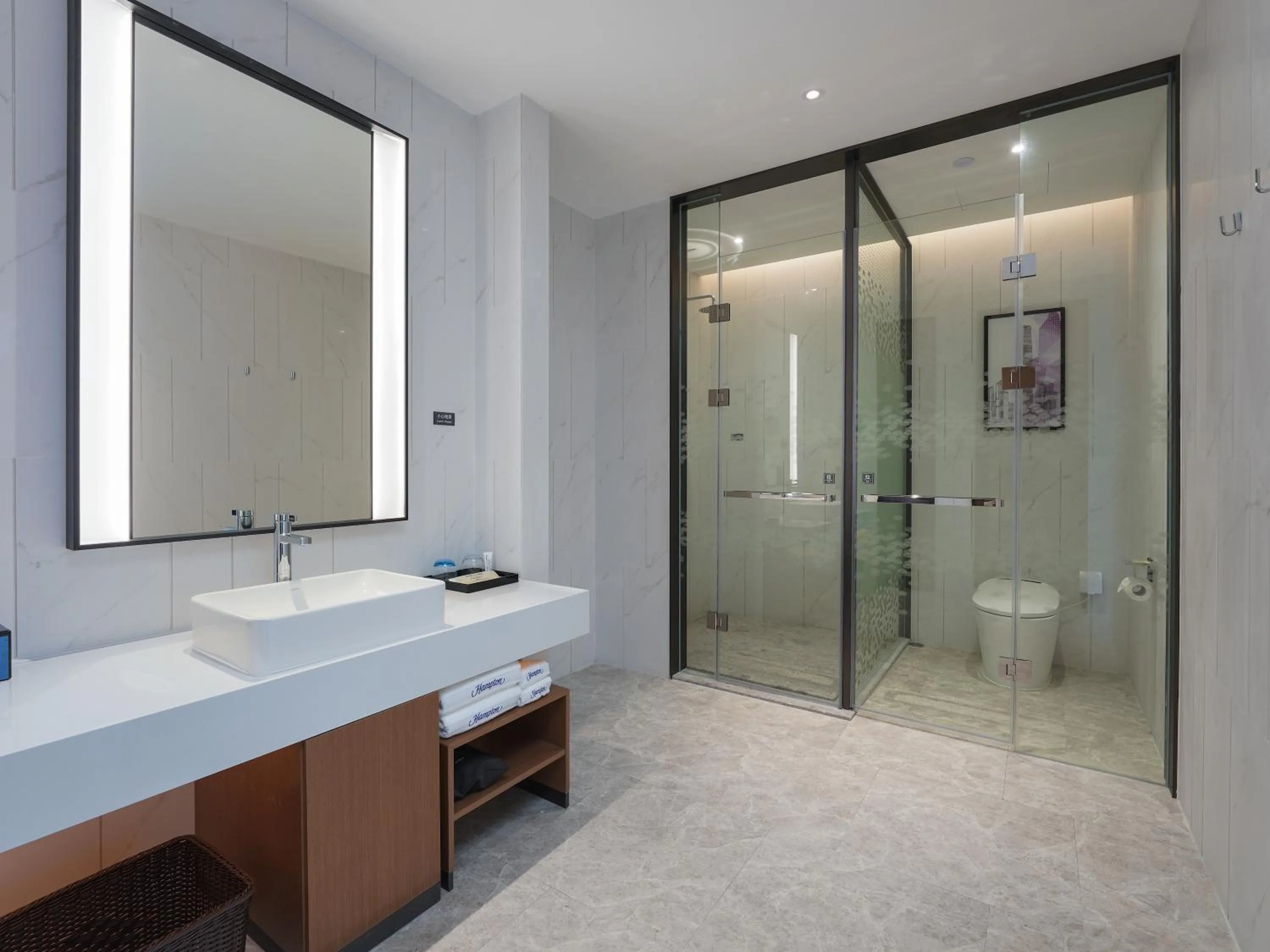 Toilet in Hampton by Hilton Dongguan Fenggang