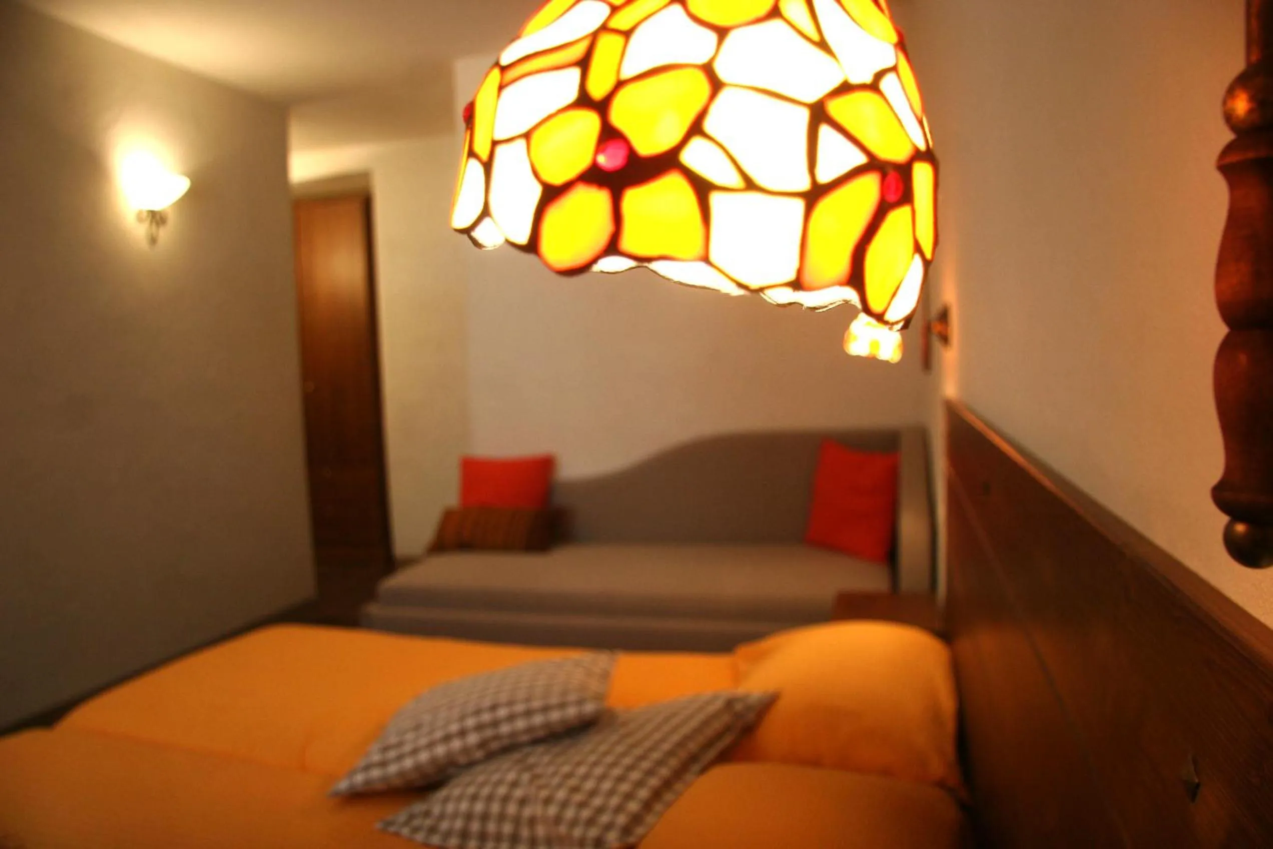 Decorative detail, Bed in Ostello del Castello Tirano