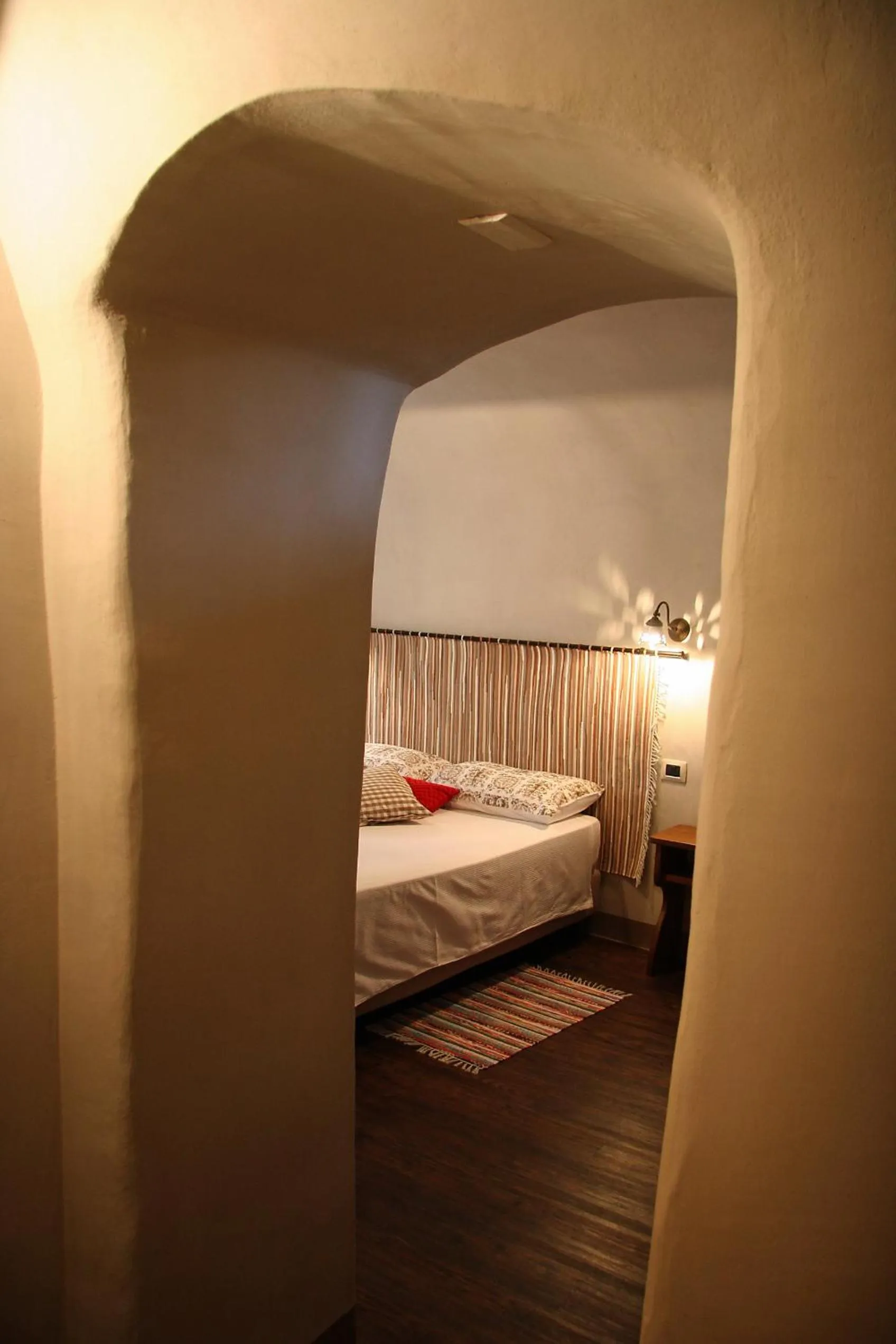 Decorative detail, Bed in Ostello del Castello Tirano