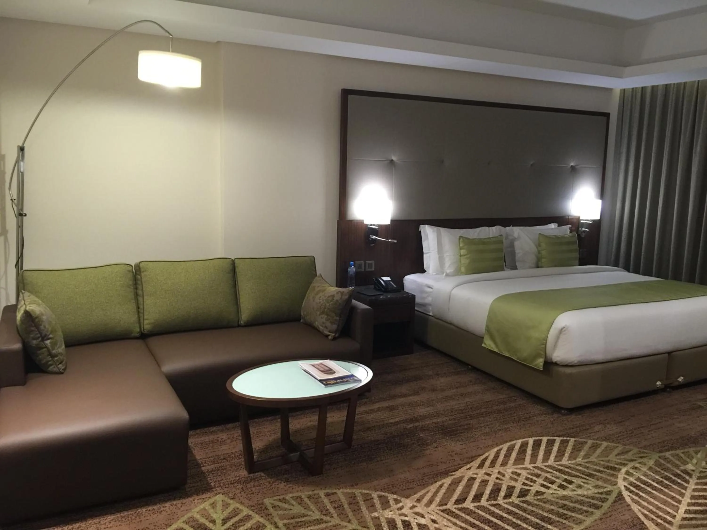 Seating area, Bed in Ramee Rose Hotel