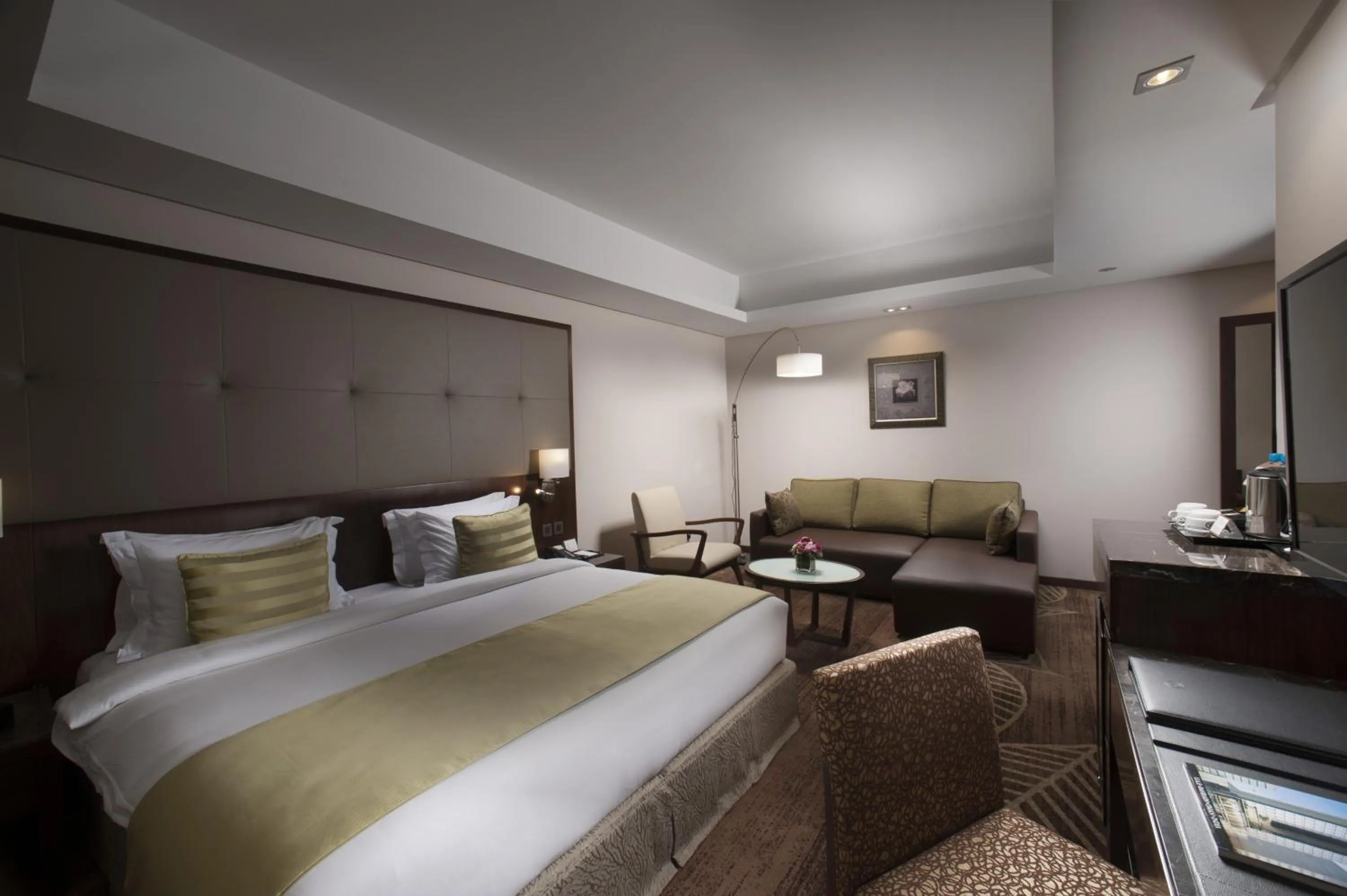 Seating area, Bed in Ramee Rose Hotel