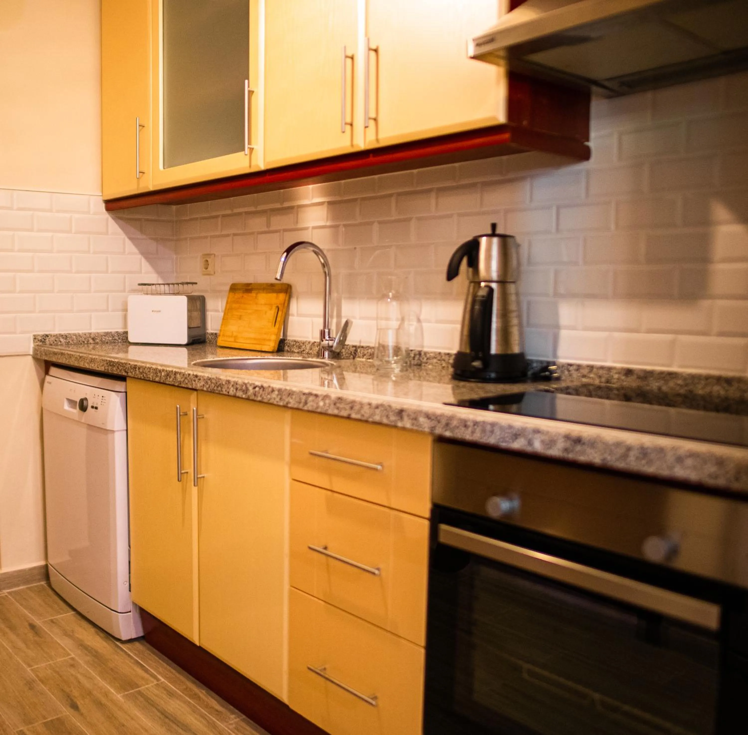 Kitchen or kitchenette in Dores Residence