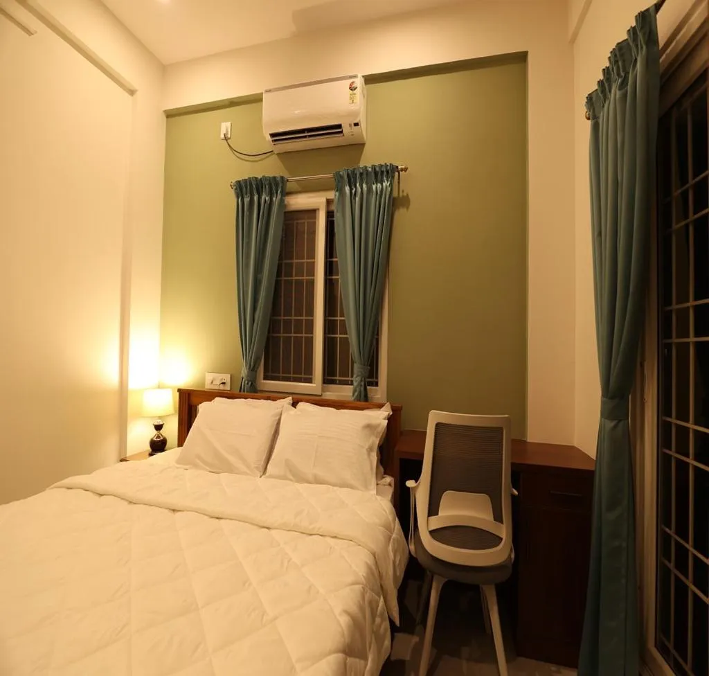 Bed in Olivette Suites