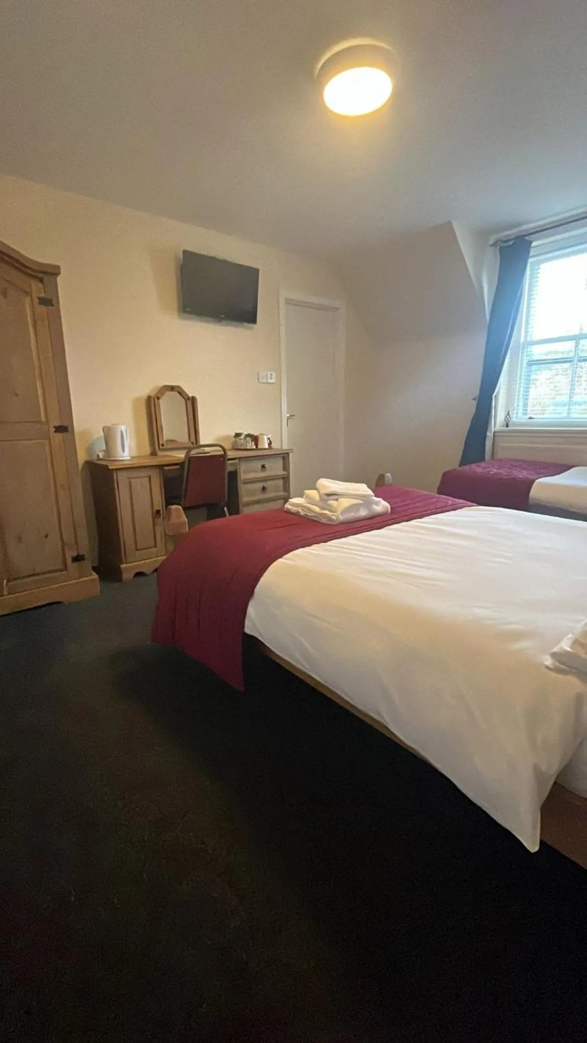 Bed in Novar Arms Hotel