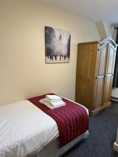 Bed in Novar Arms Hotel